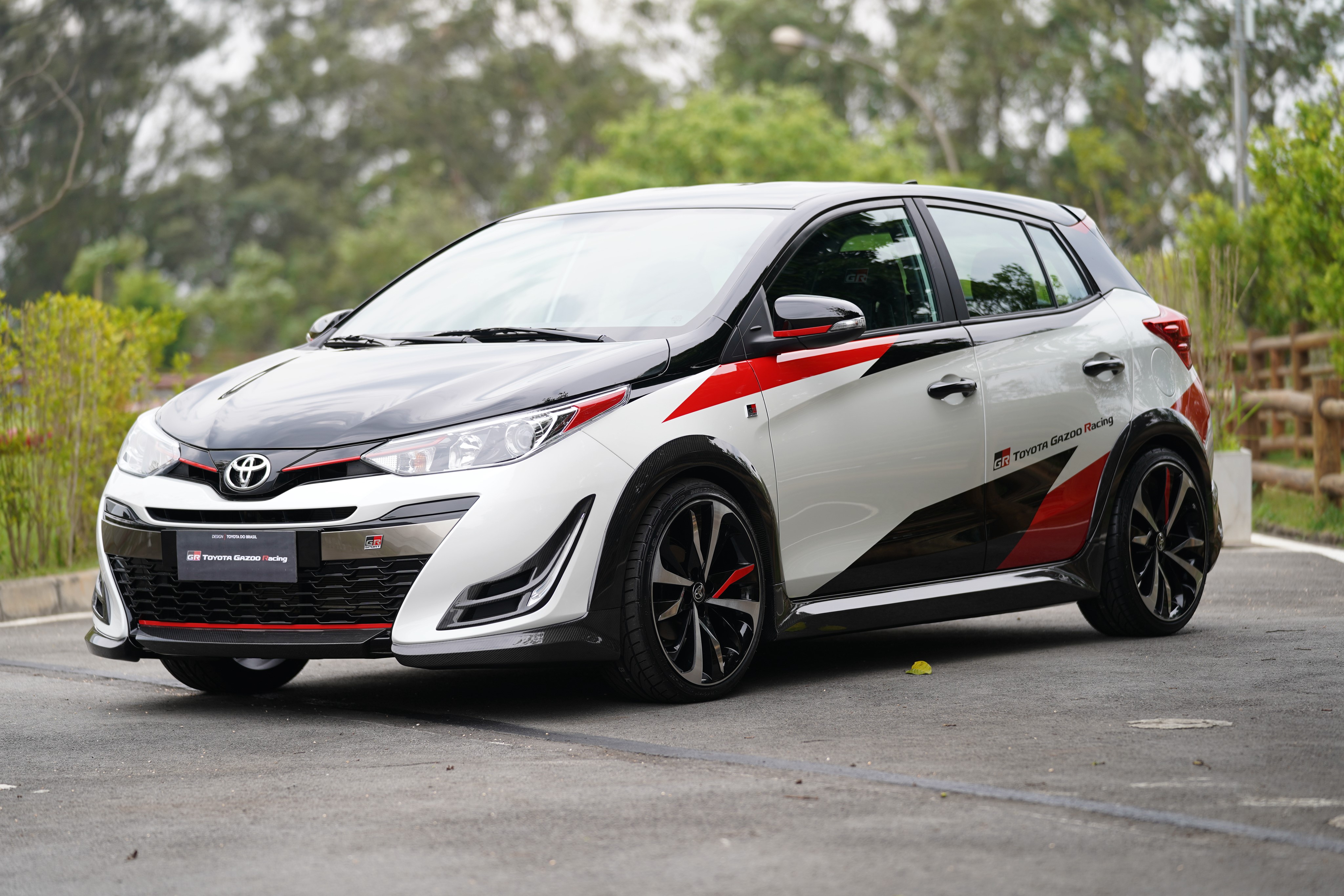 White Toyota Yaris GR Sport with Red and Black Decals HD Wallpaper