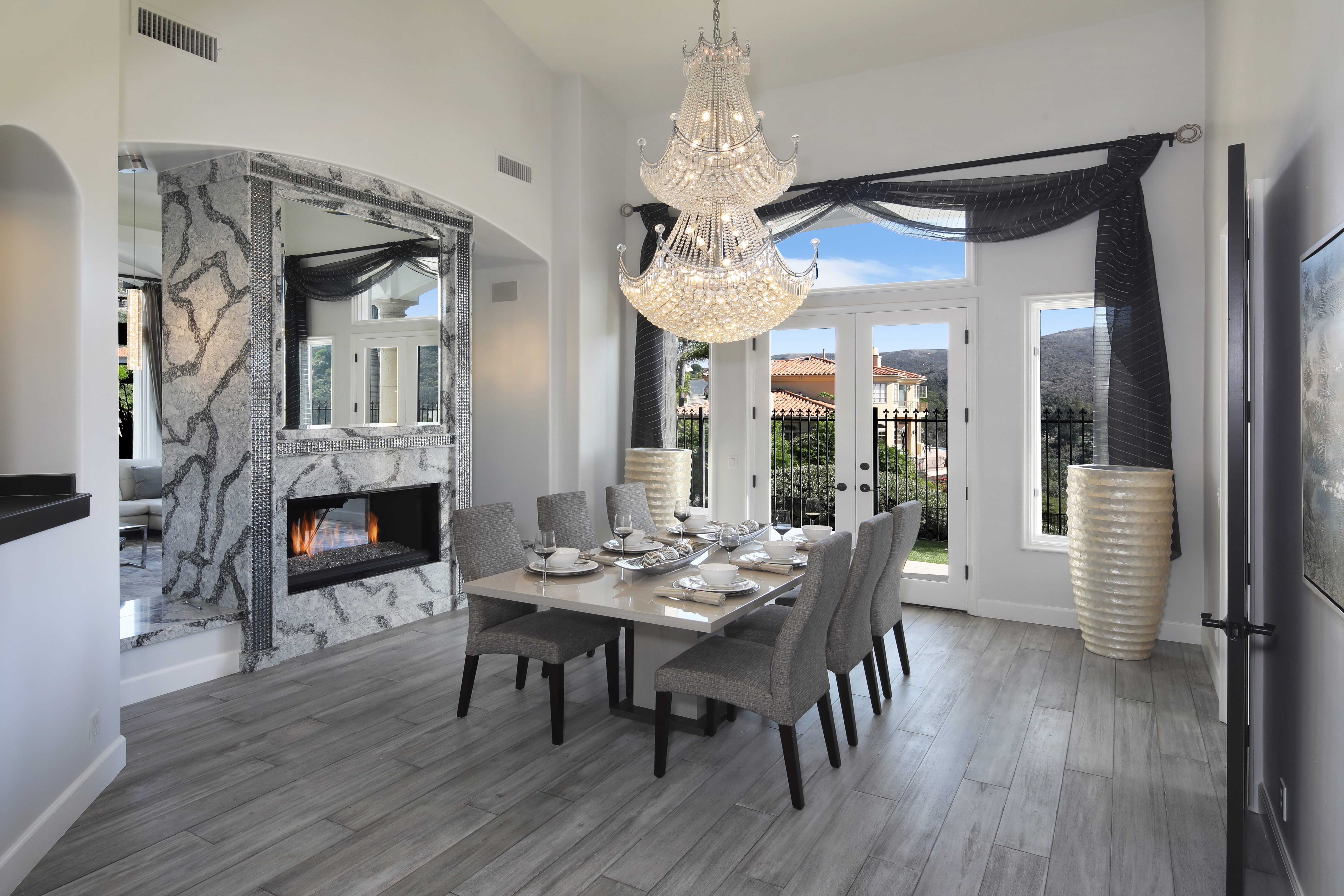 Dining room with fireplace and chandelier HD Wallpaper