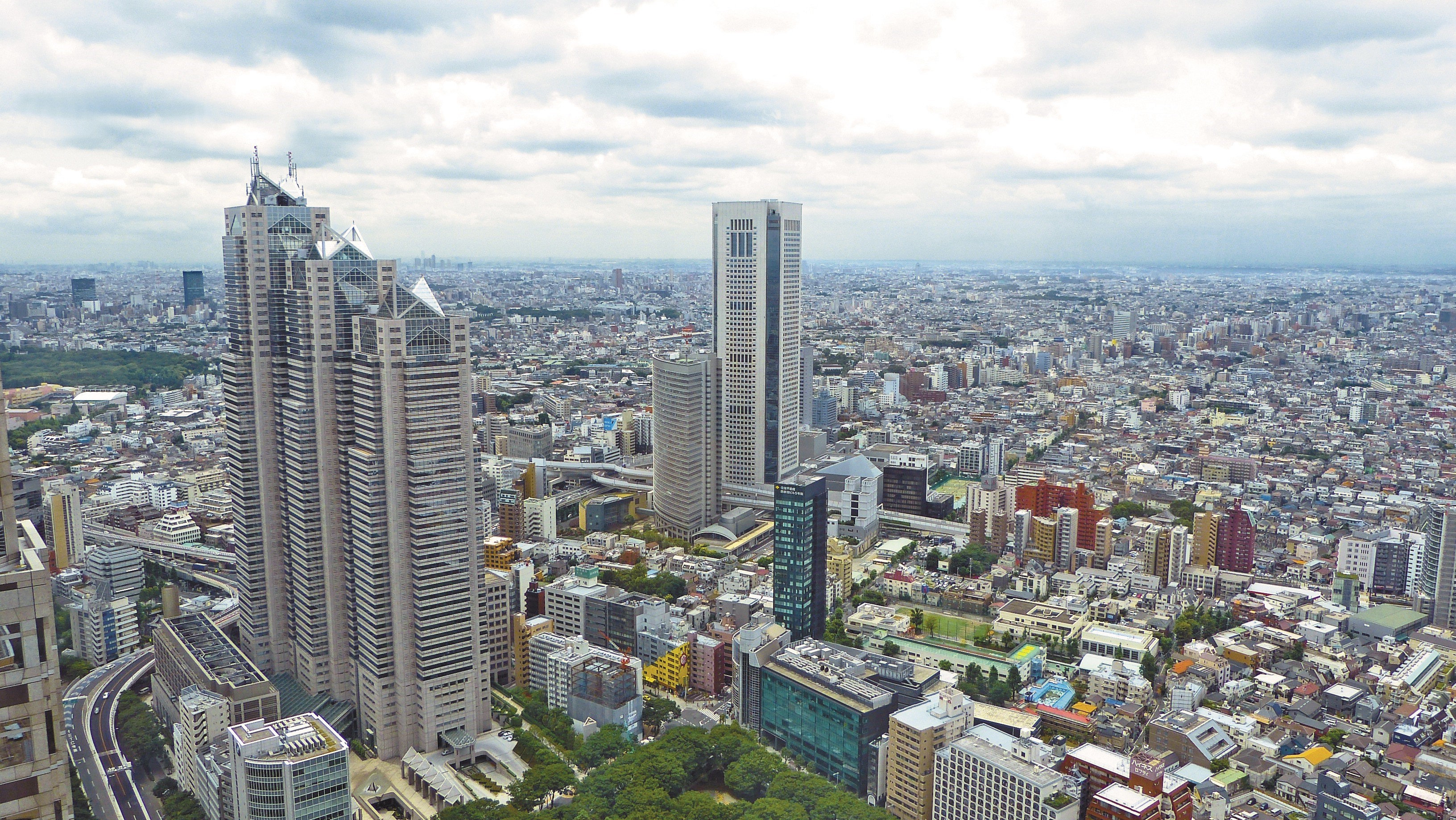 Tokyo cityscape with skyscrapers and urban sprawl HD Wallpaper
