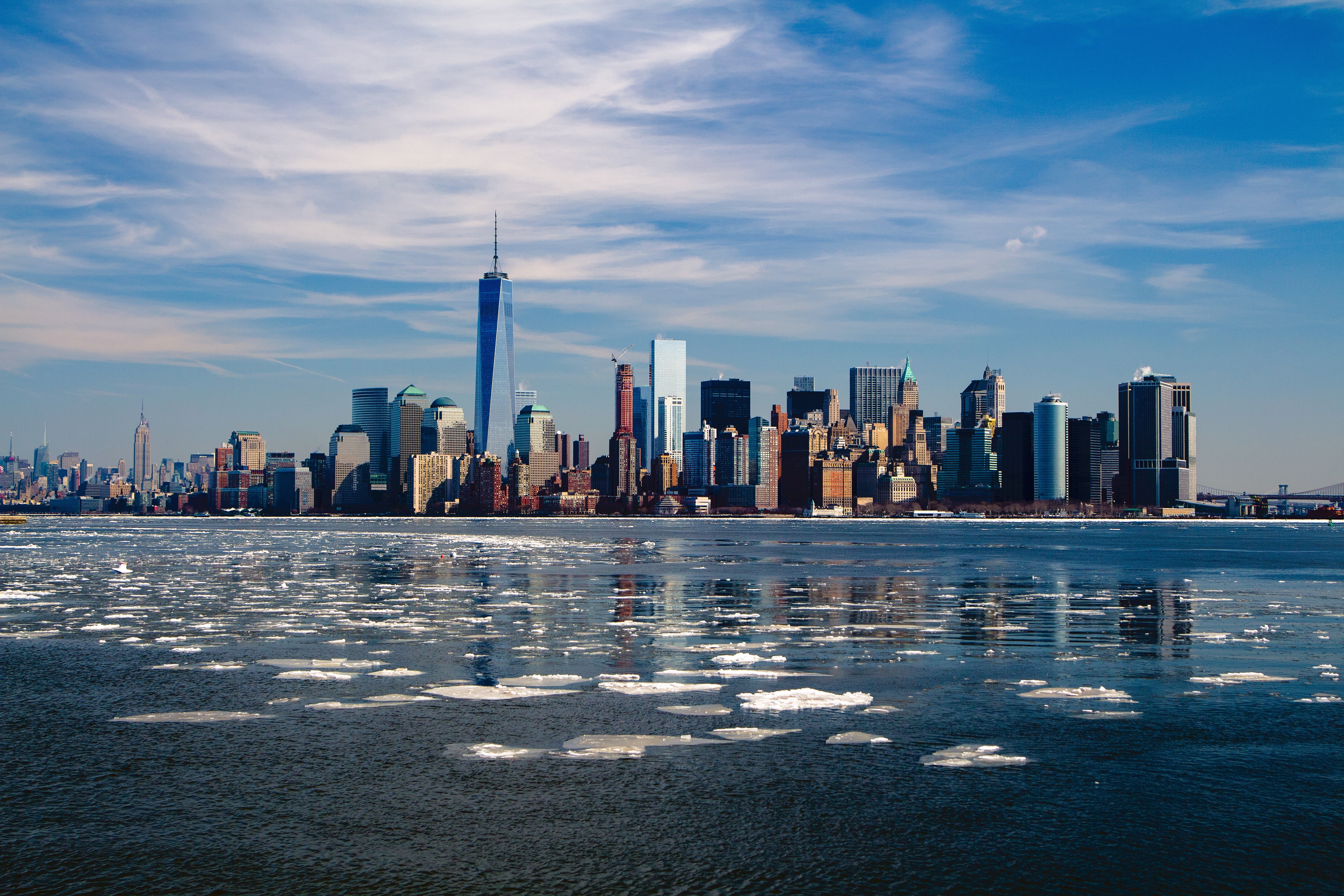 New York City skyline with One World Trade Center and ice floes HD Wallpaper