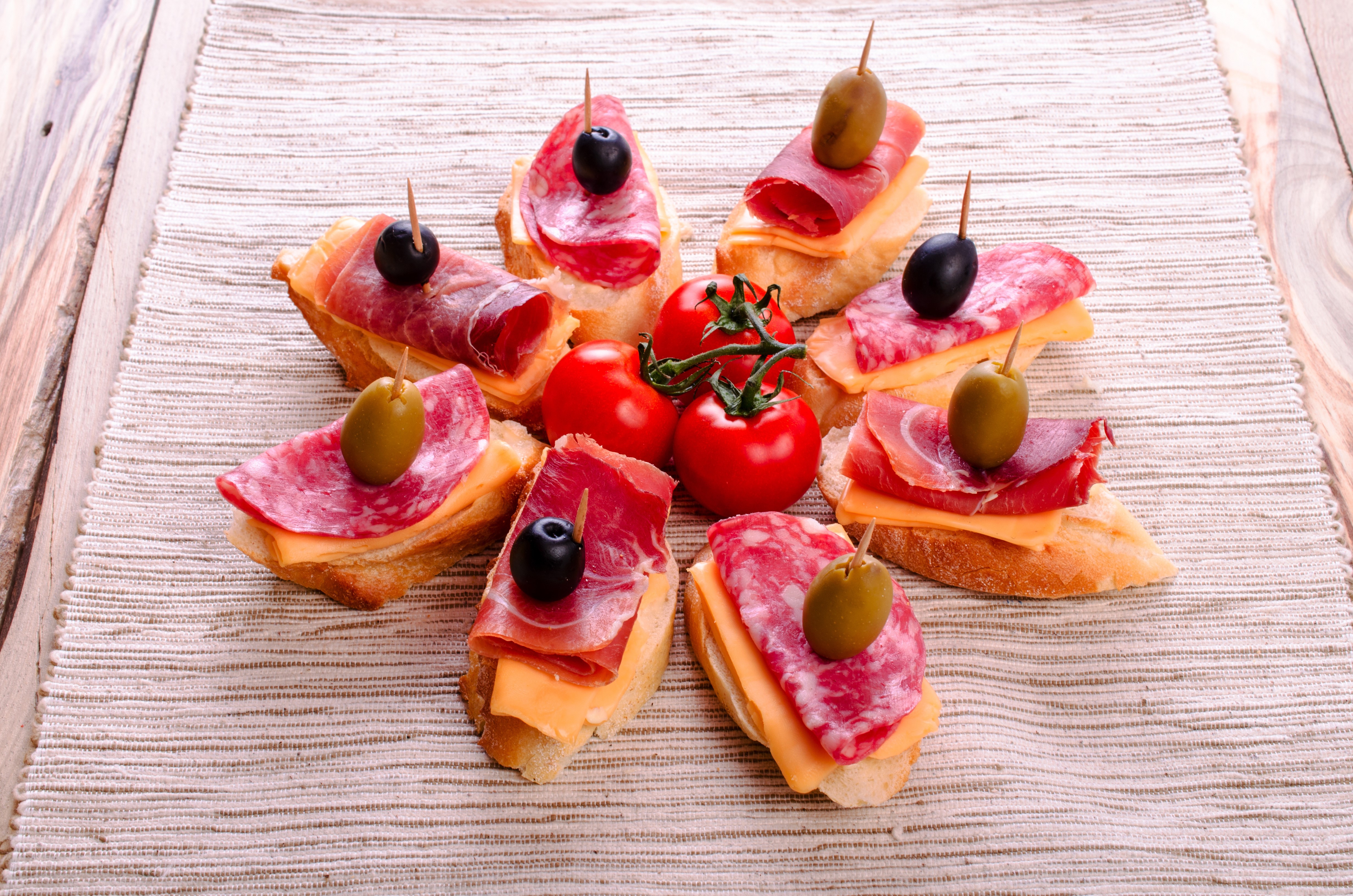 Tapas with sausage, ham, cheese, olives, and tomatoes HD Wallpaper