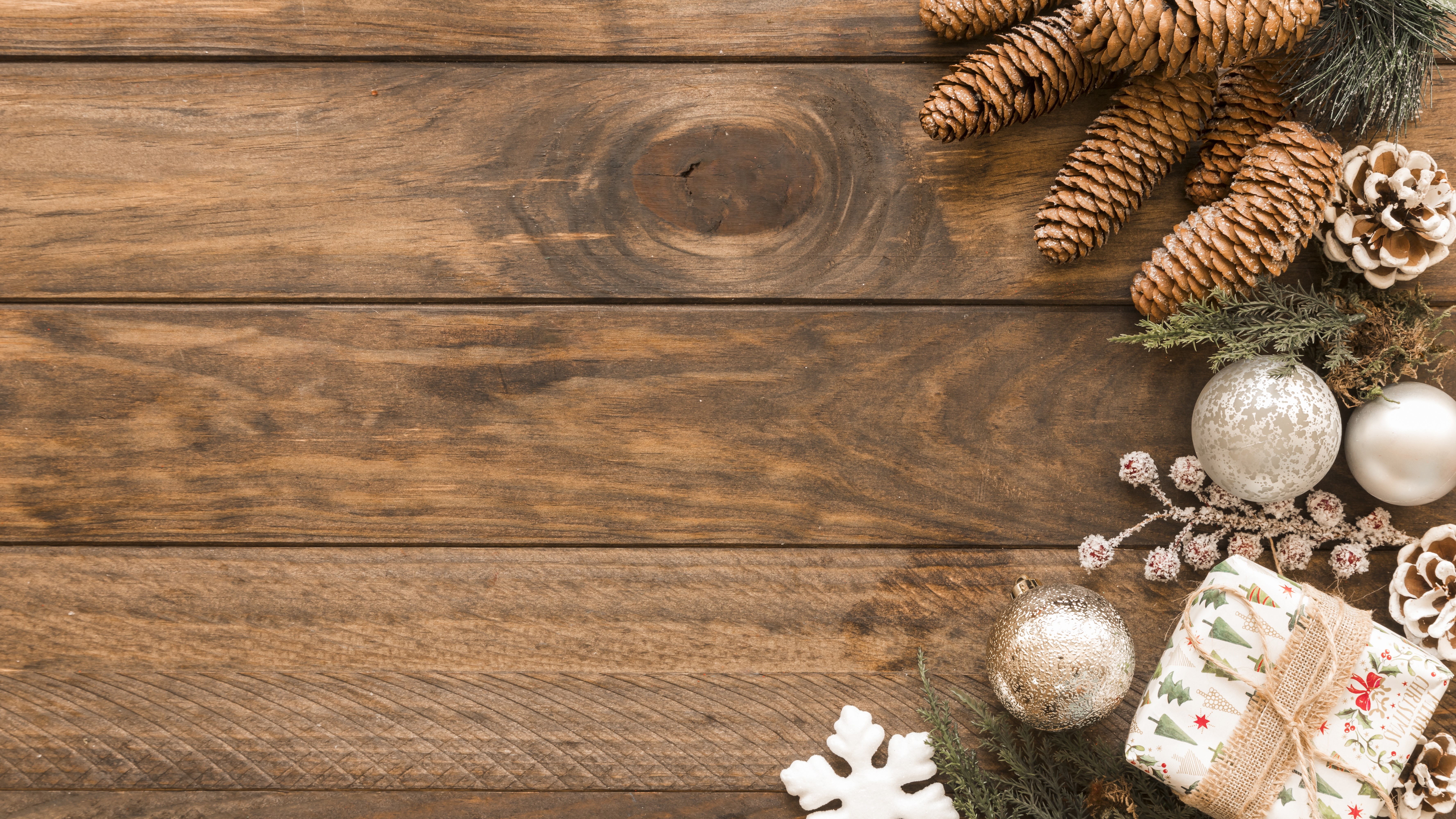 Christmas pine cones and ornaments on wood planks HD Wallpaper