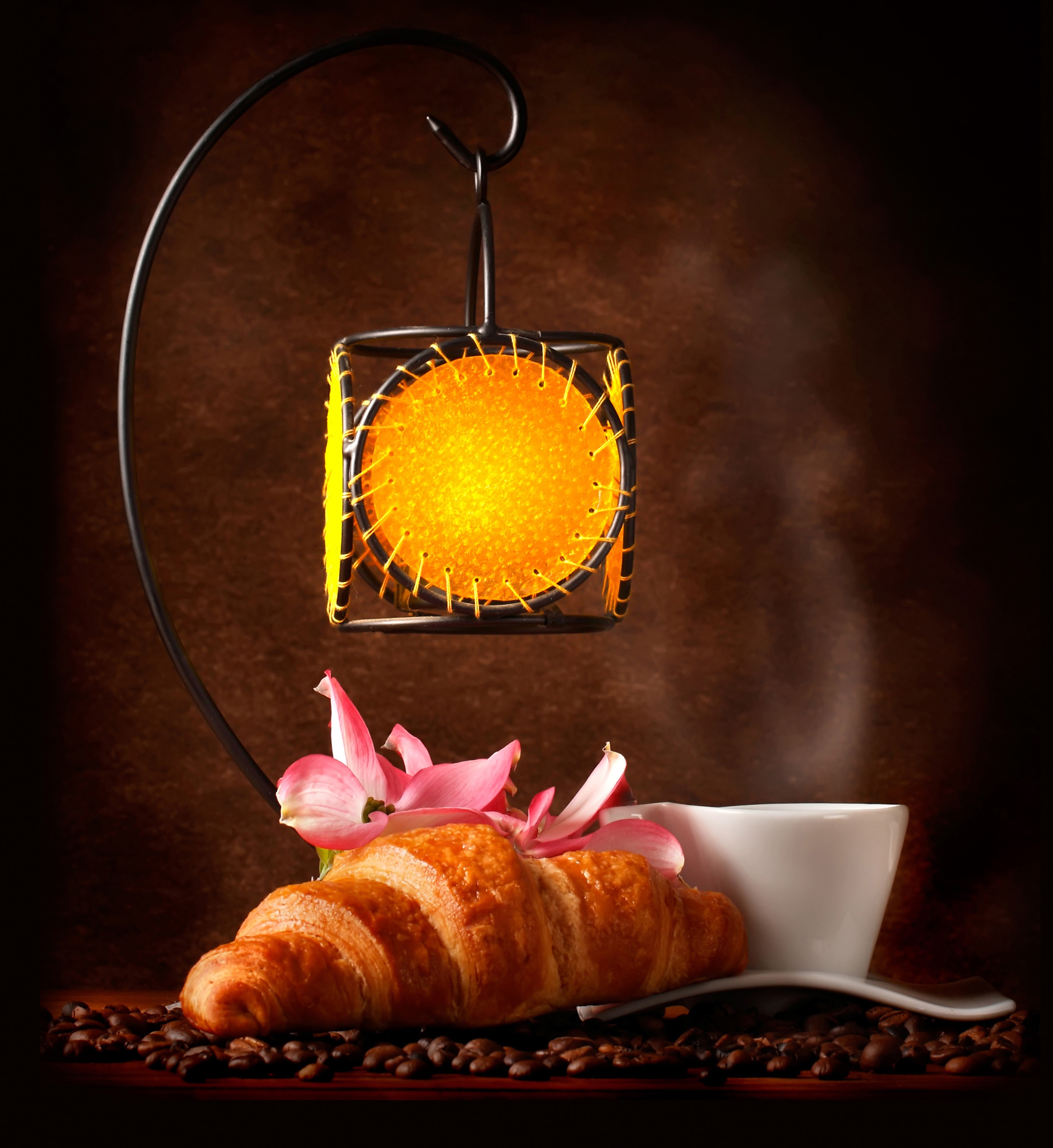 Croissant, coffee cup, and lantern with flowers HD Wallpaper