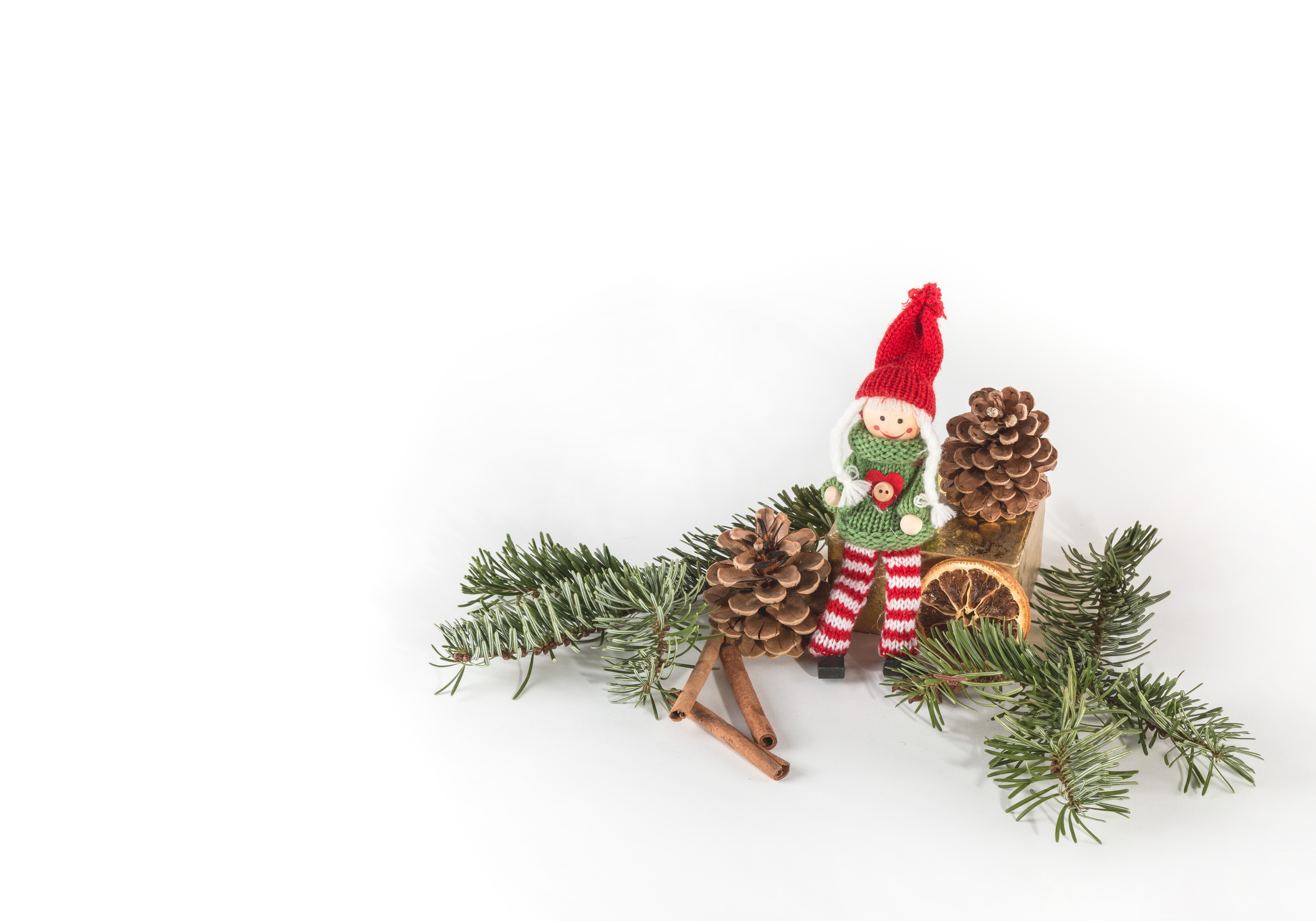 Christmas elf doll with pine cones and fir branches HD Wallpaper