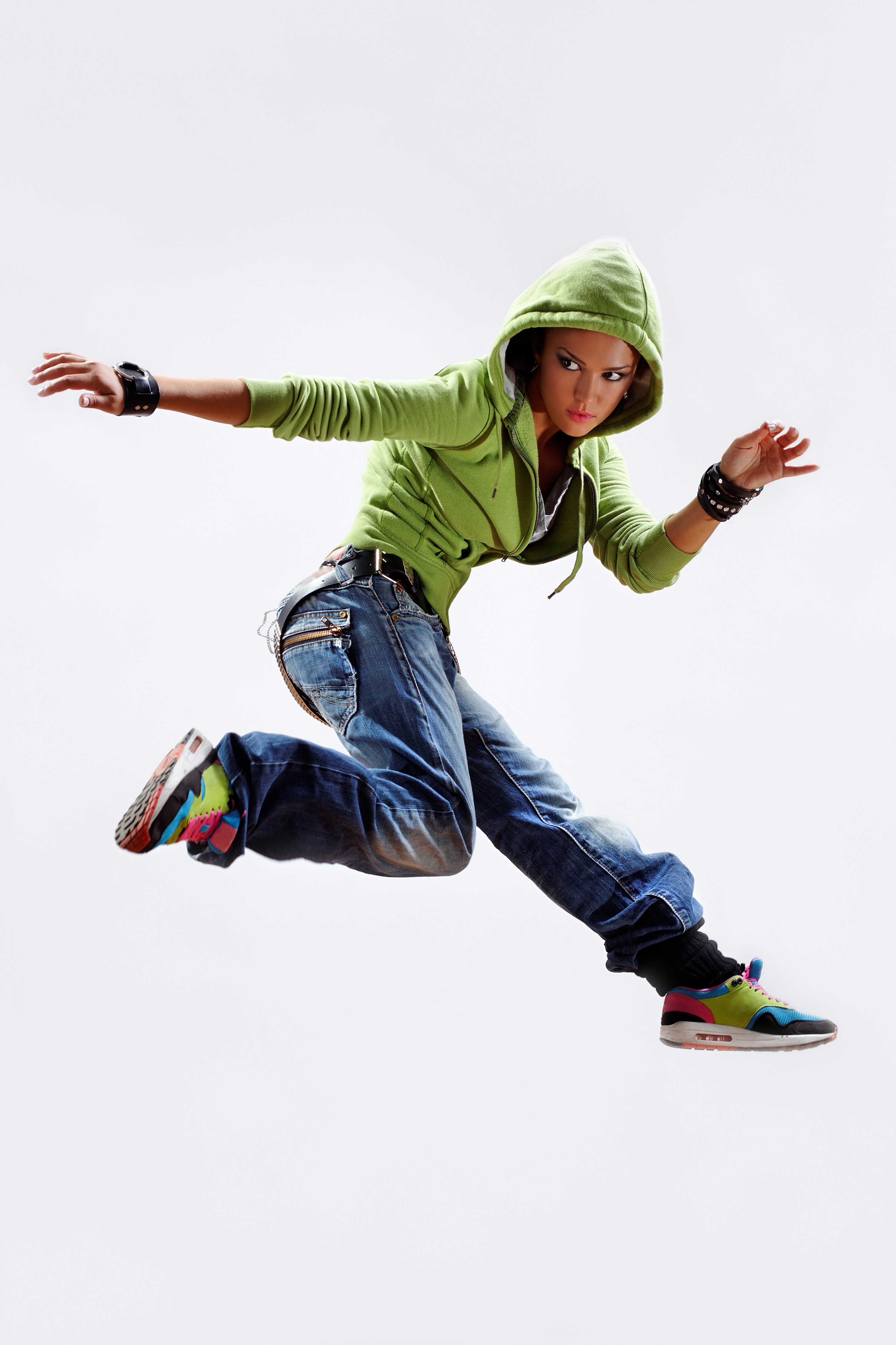Woman in green hoodie and jeans jumping HD Phone Wallpaper