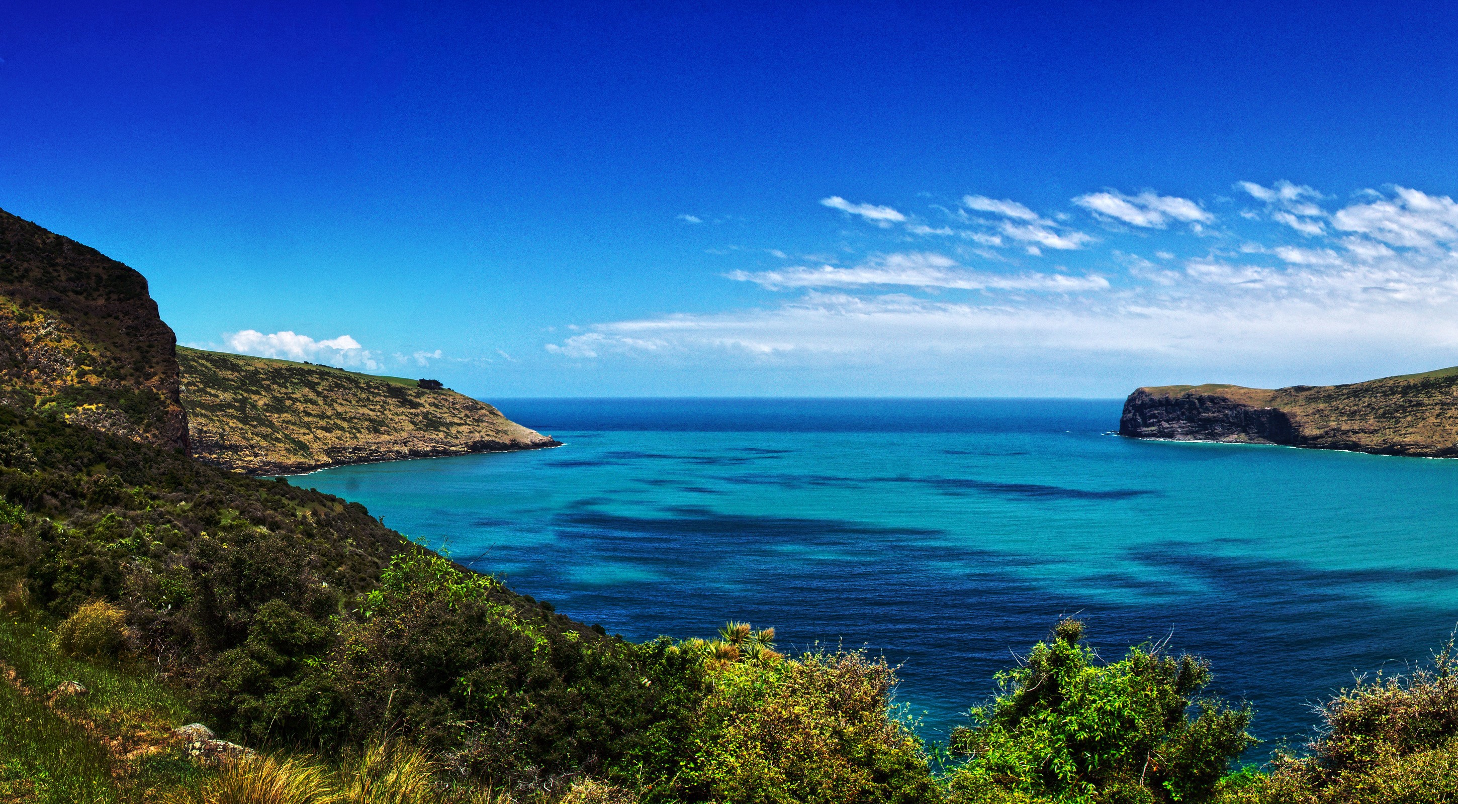 Coastal bay with cliffs and turquoise water HD Wallpaper