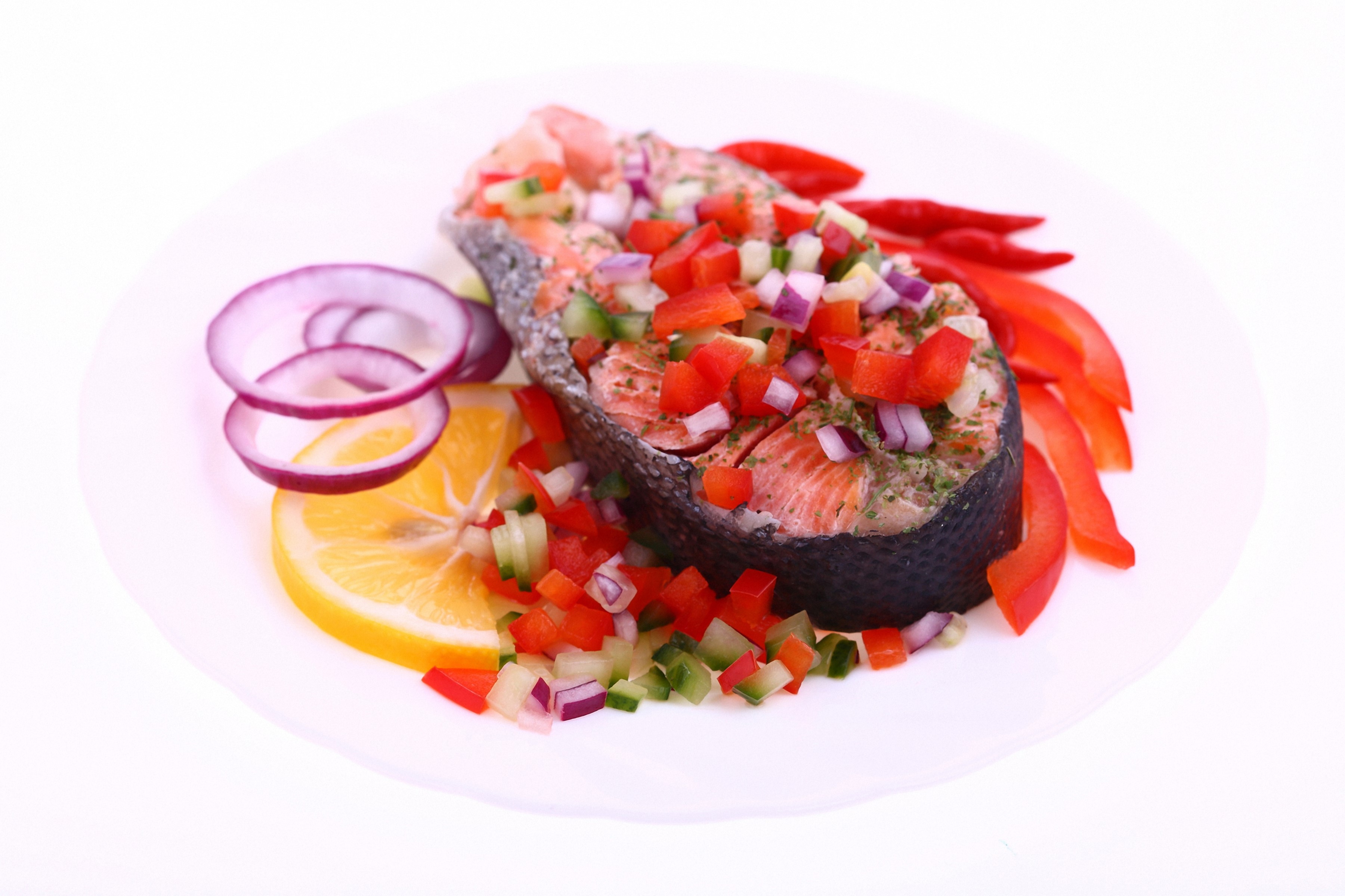Salmon steak with chopped vegetables and lemon on a plate HD Wallpaper