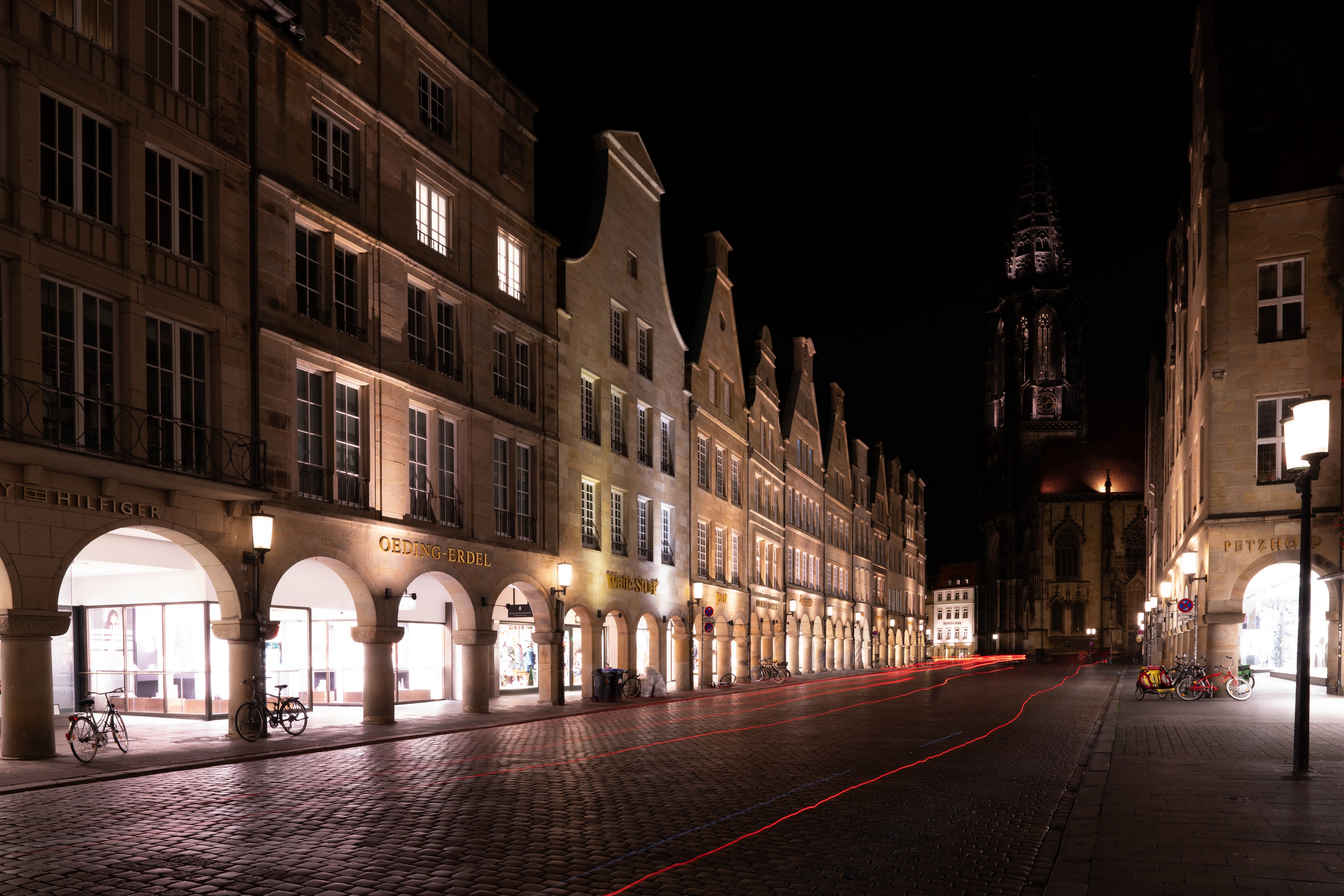 Night street in Muenster, Germany with historic buildings and light trails HD Wallpaper