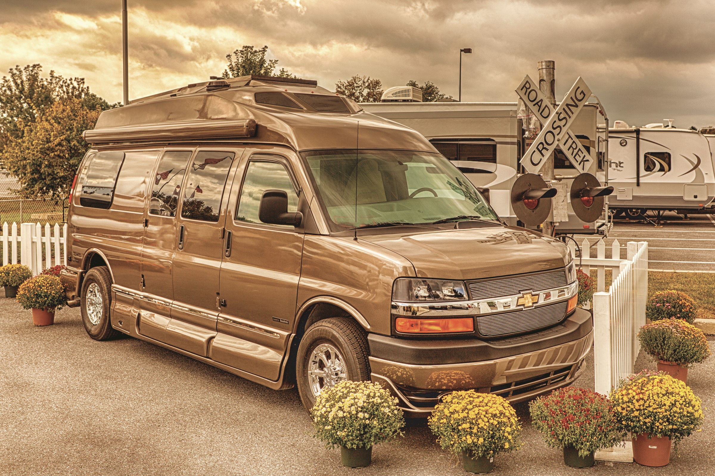 Brown Chevrolet Conversion Van with RVs and Railroad Crossing HD Wallpaper