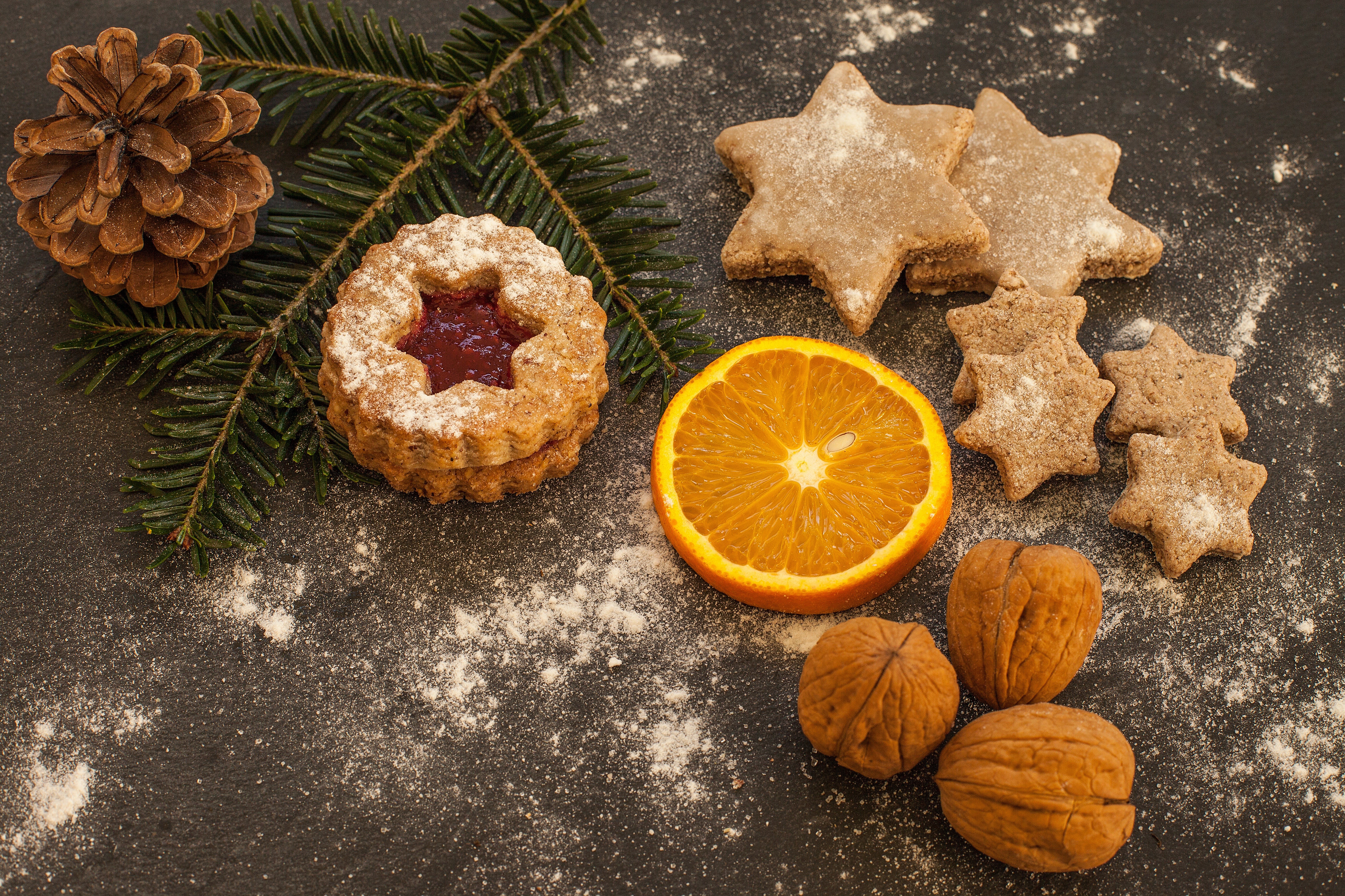 Christmas cookies with pine cone, orange slice, and walnuts HD Wallpaper