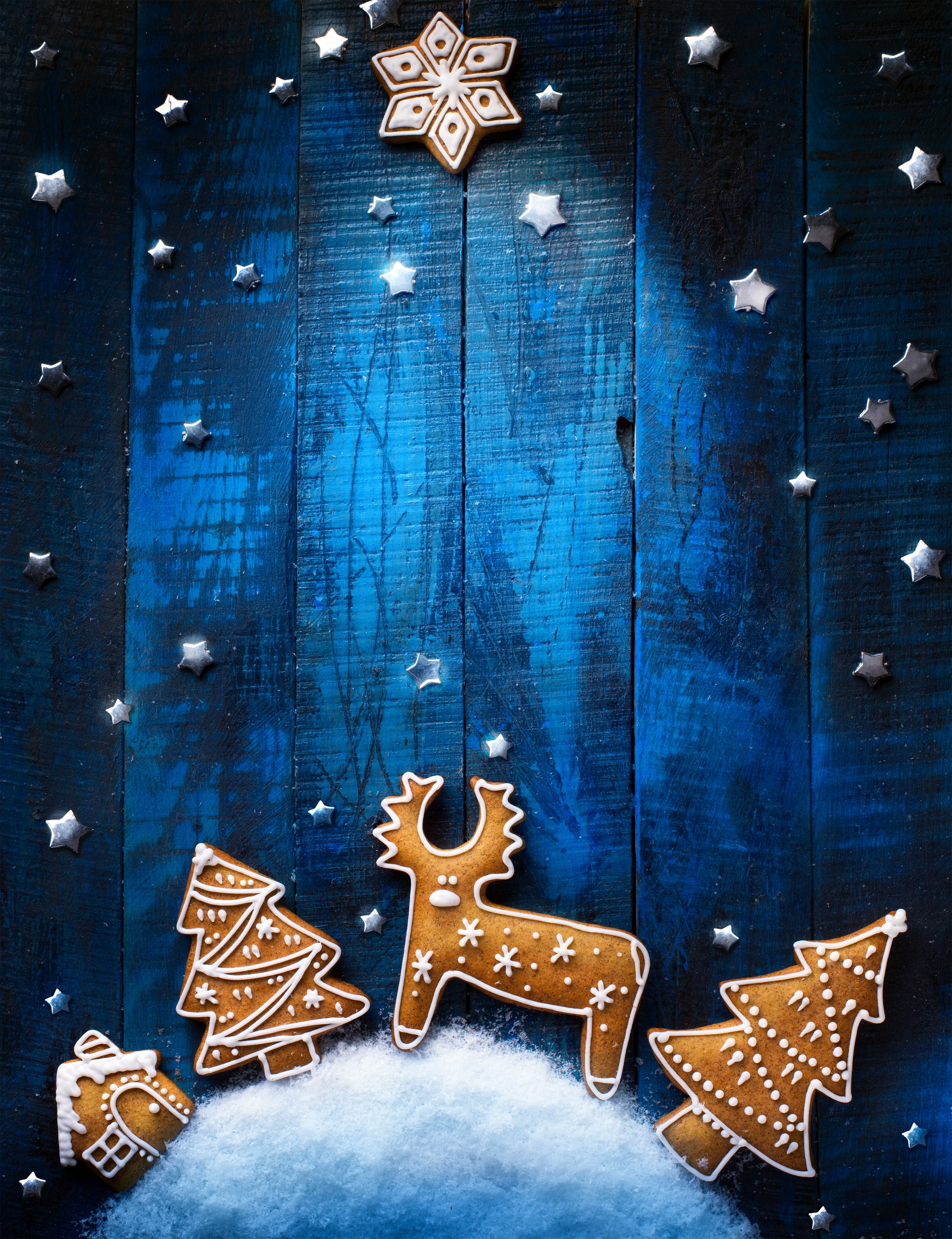 Christmas gingerbread cookies on a blue wooden background HD Phone Wallpaper