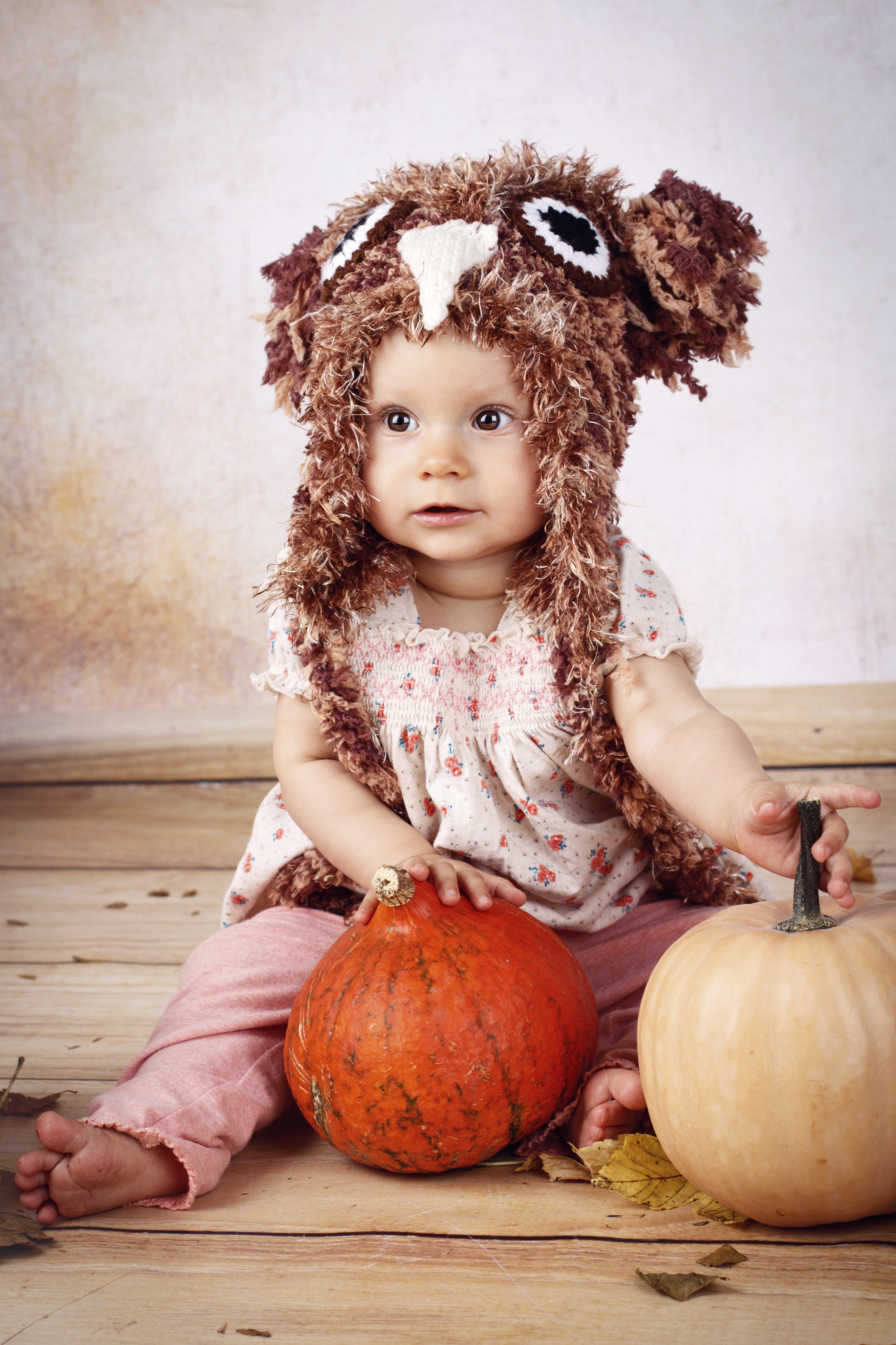 Baby in owl hat with pumpkins HD Phone Wallpaper