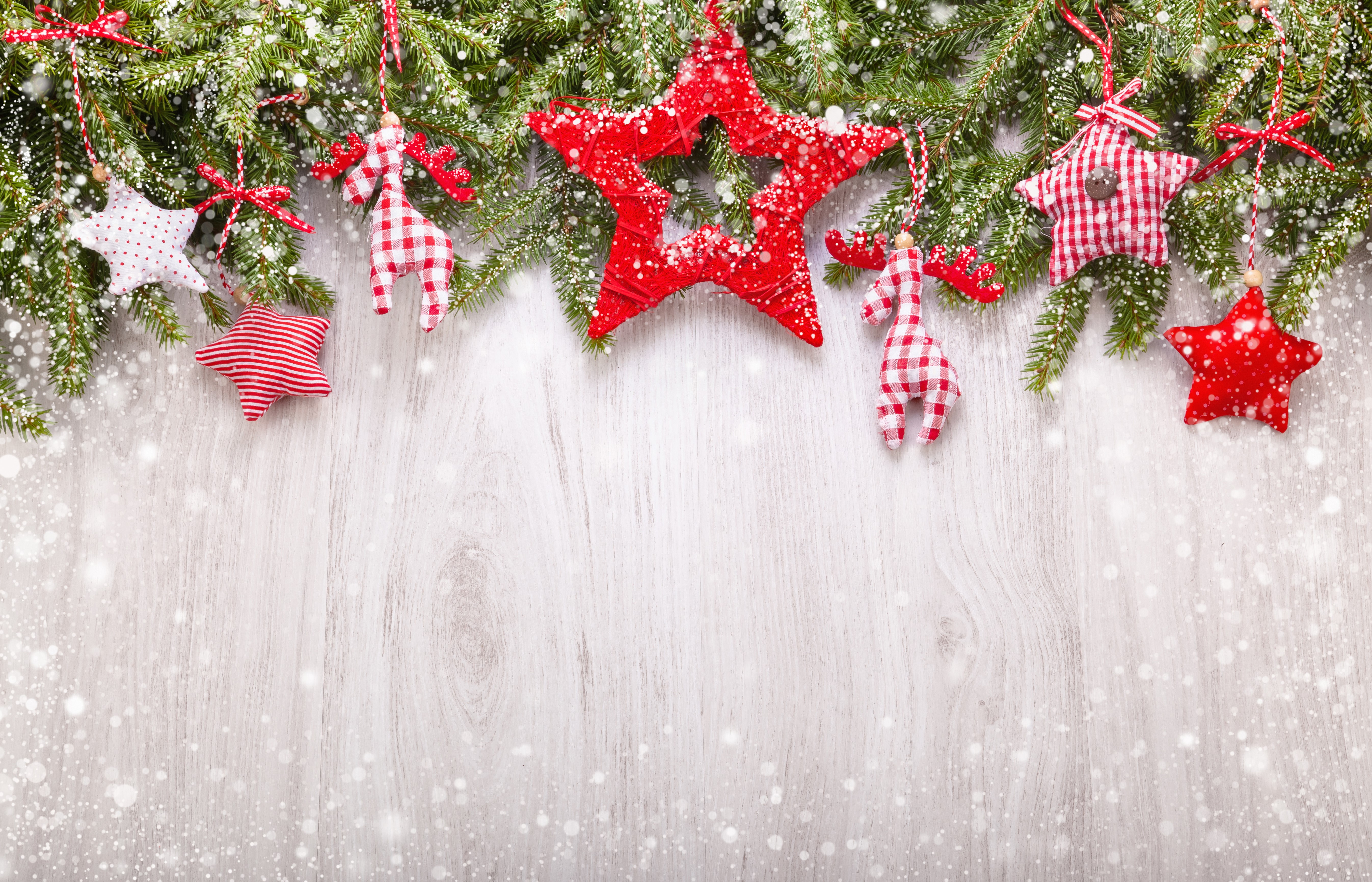 Christmas fir branches with red star and deer ornaments HD Wallpaper