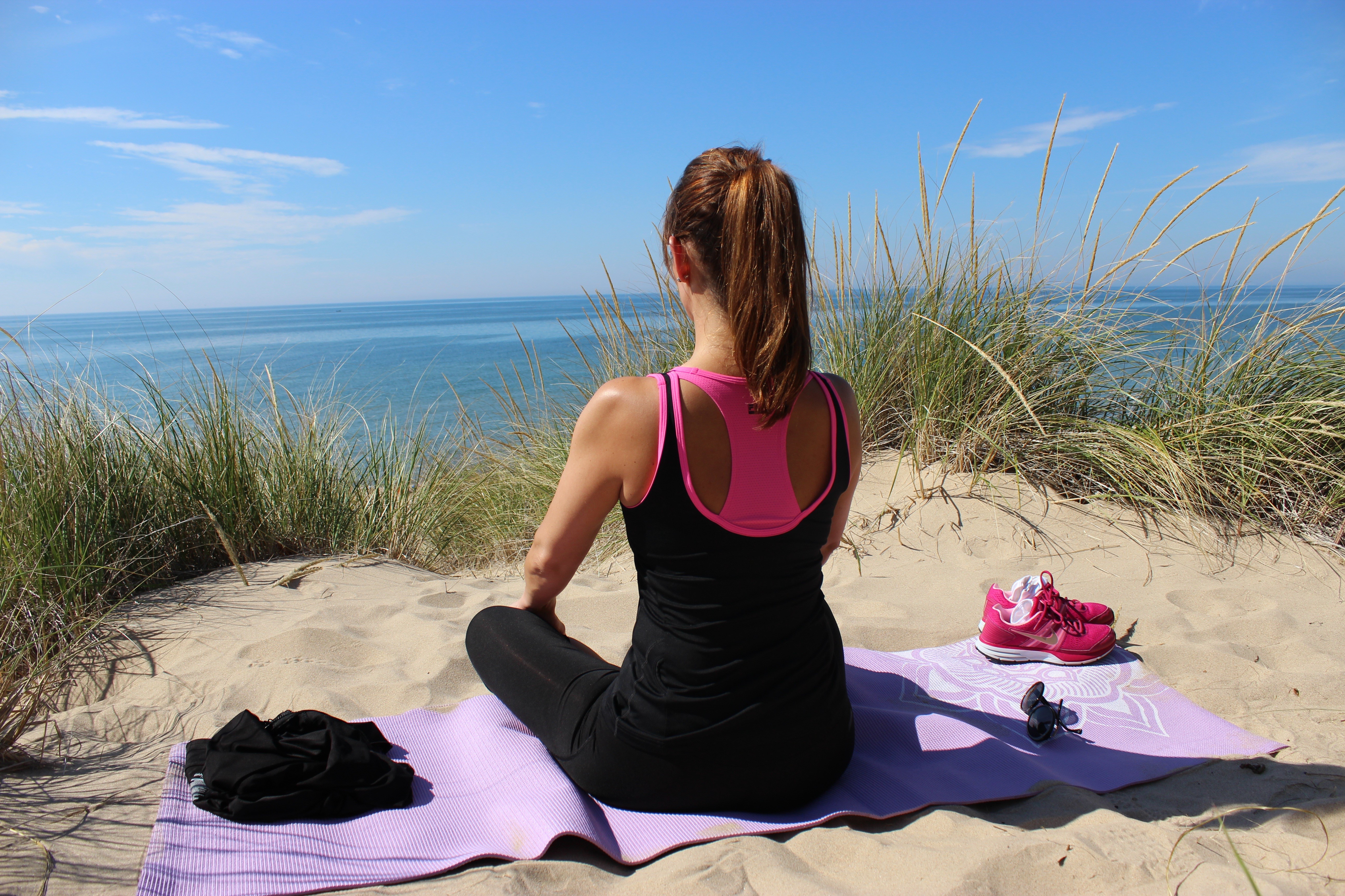 Woman doing yoga on the beach HD Wallpaper