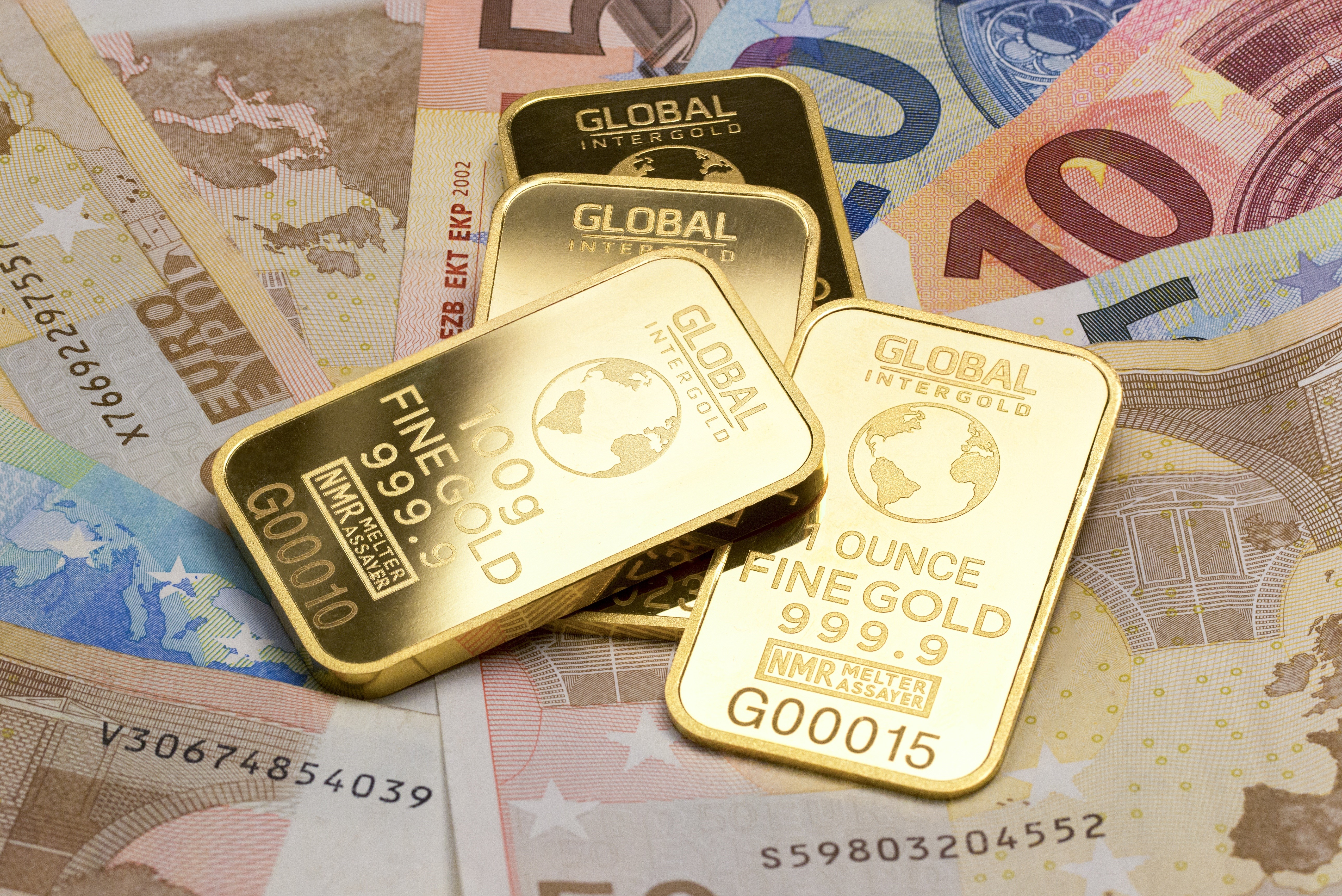 Gold ingots on Euro banknotes HD Wallpaper