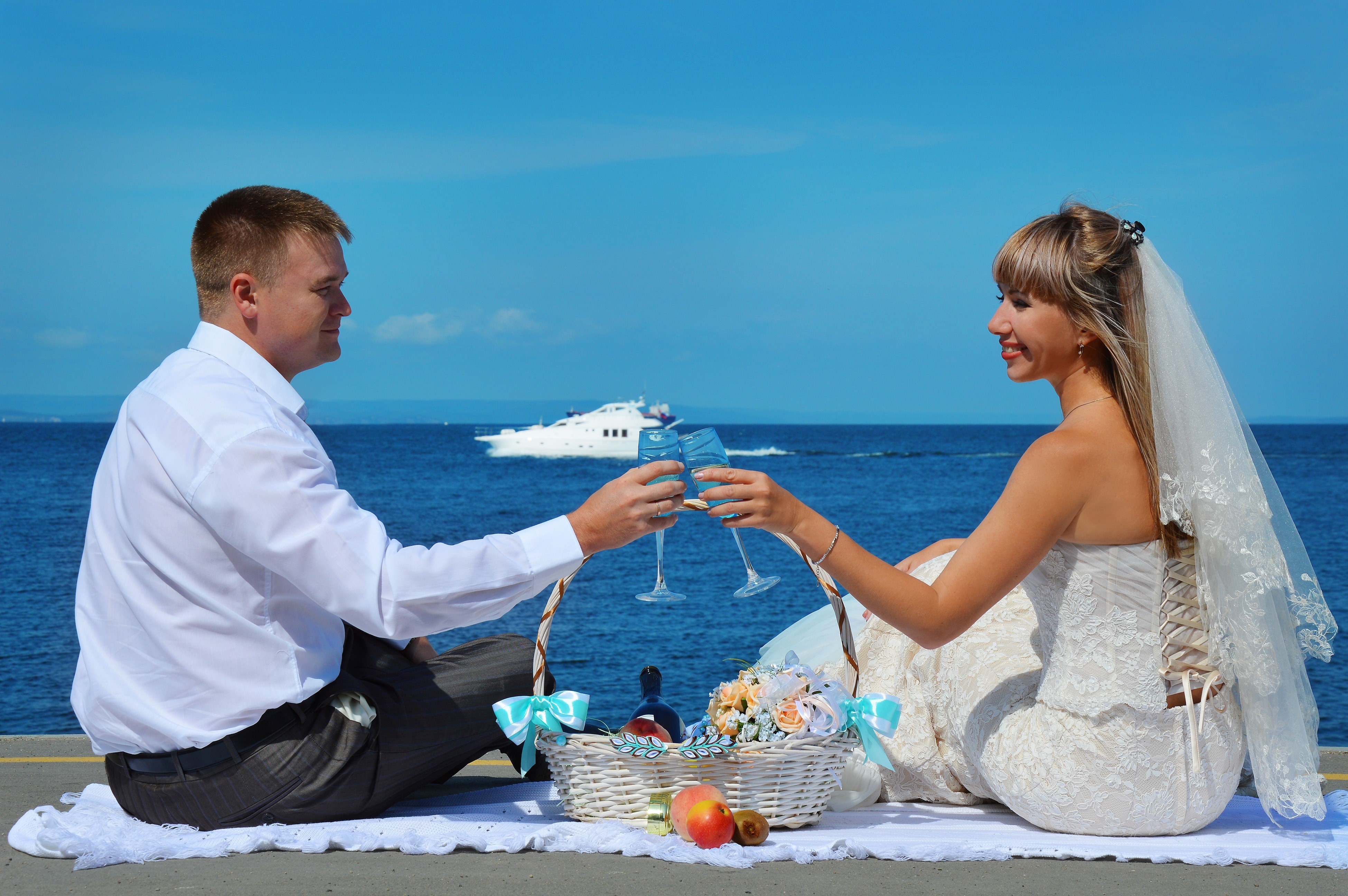 Bride and Groom Toasting with Champagne by the Sea HD Wallpaper