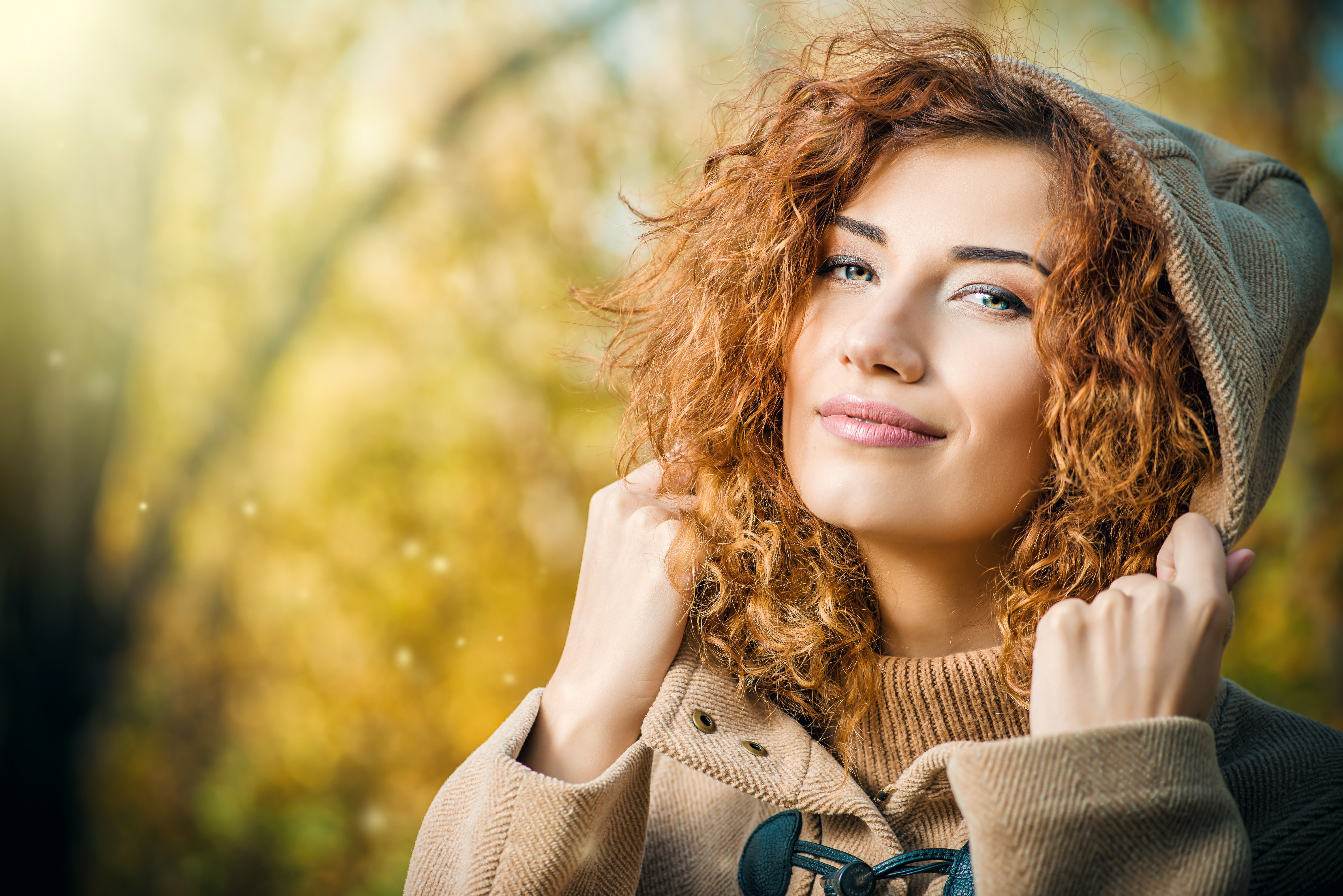 Woman with curly hair wearing a coat HD Wallpaper