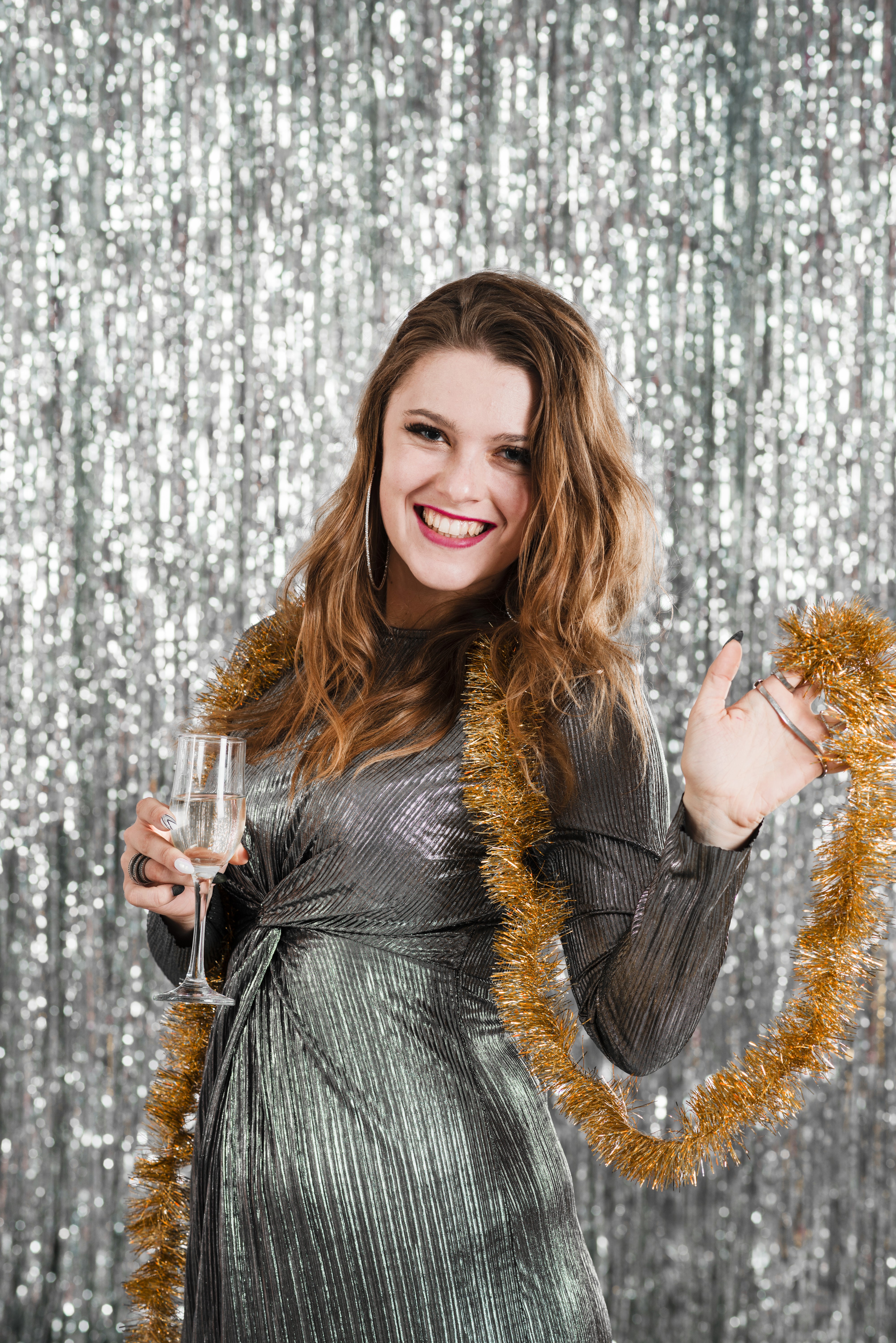 Woman with Champagne and Tinsel HD Phone Wallpaper
