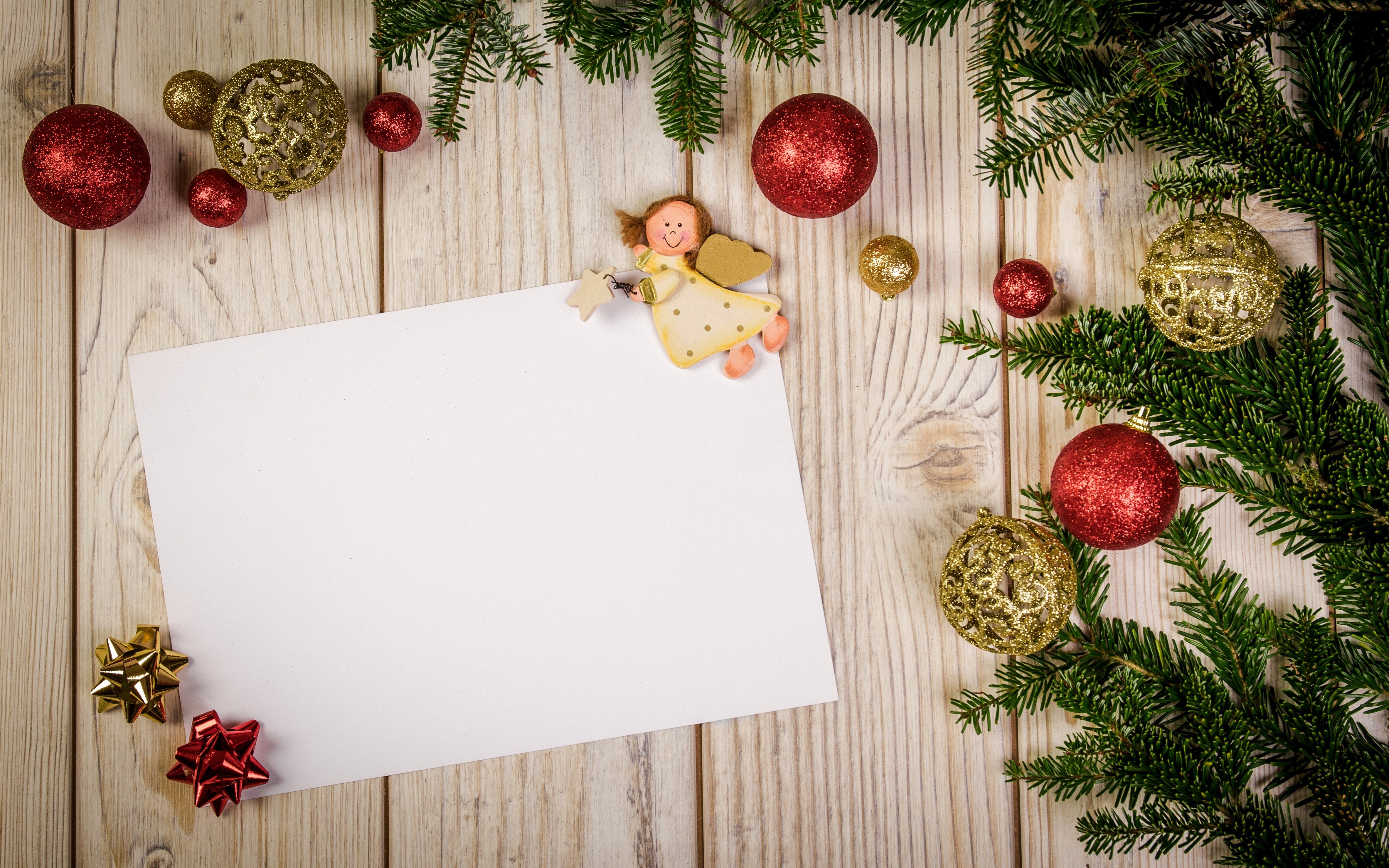 Christmas ornaments and fir branches on wood planks HD Wallpaper