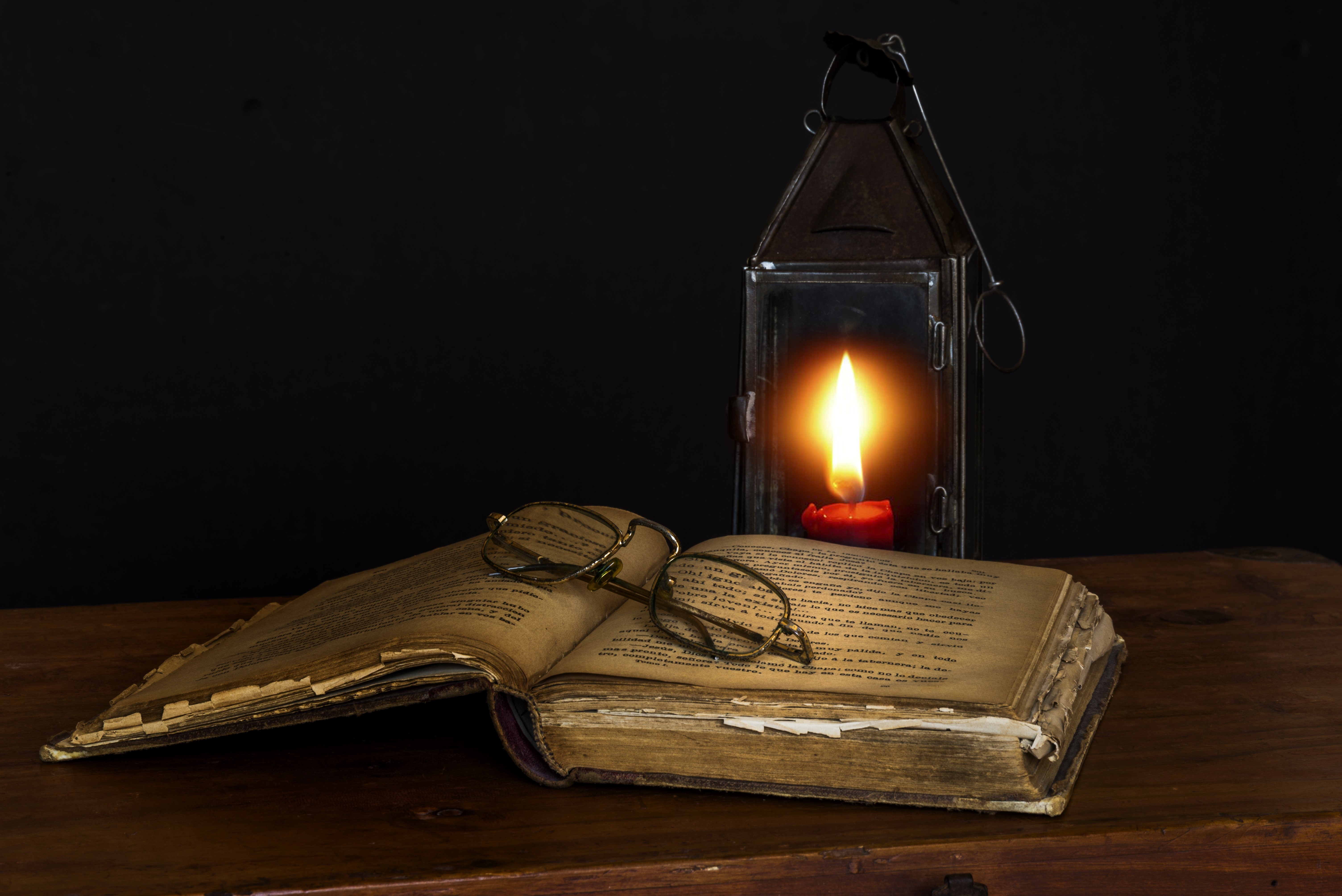 Open book with glasses and lantern with candle HD Wallpaper