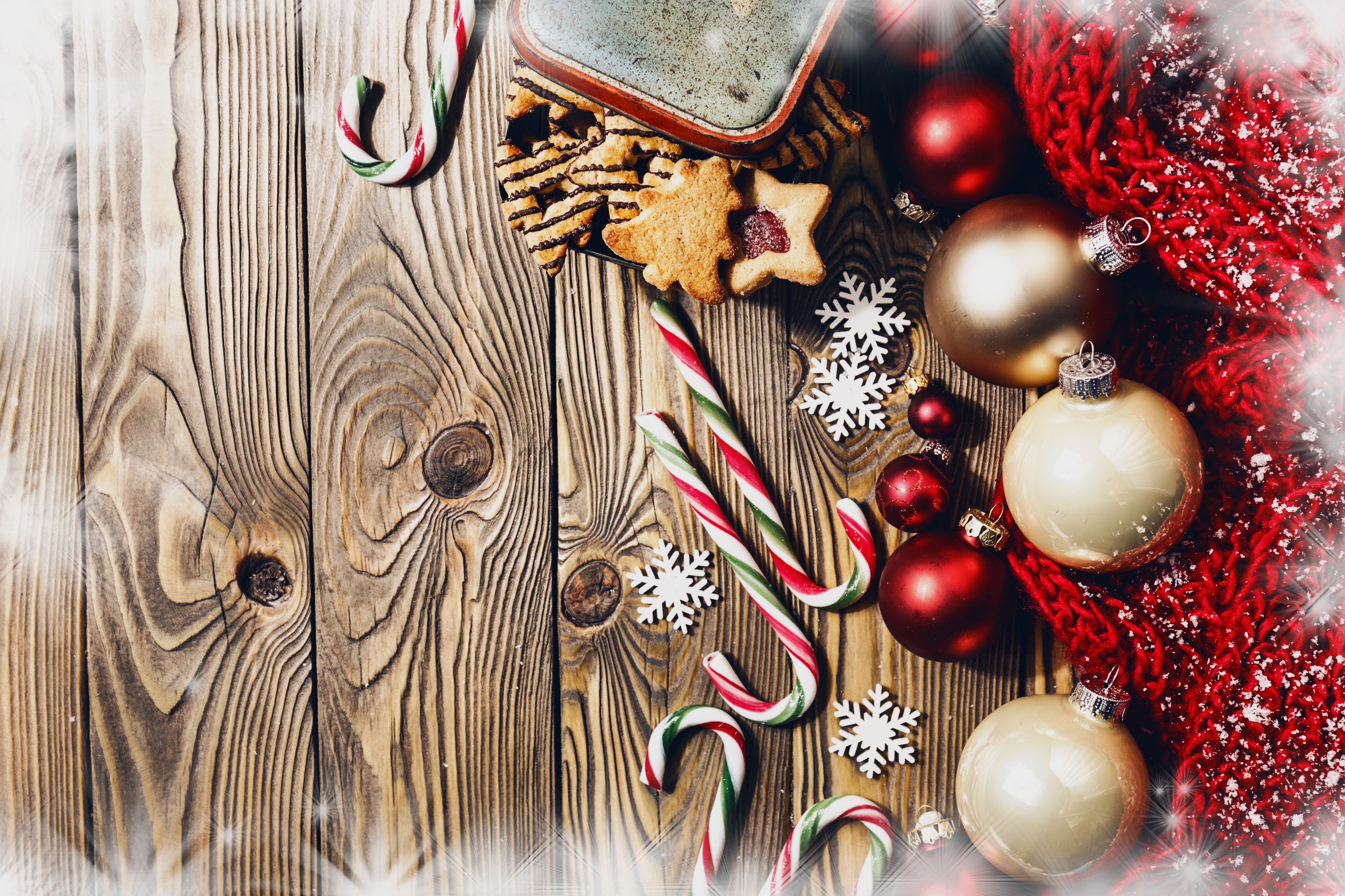 Christmas ornaments, candy canes, and cookies on wood HD Wallpaper