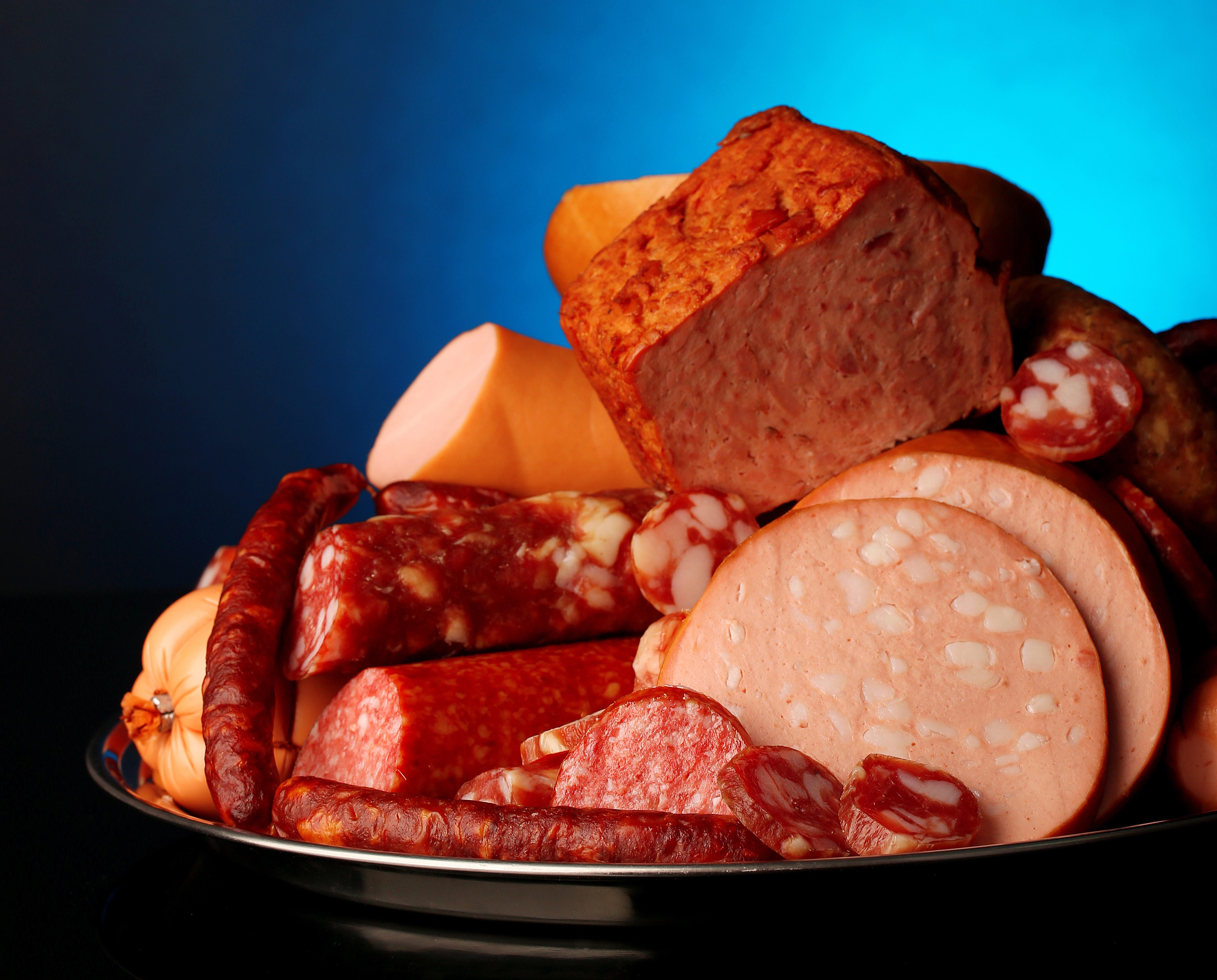 Assortment of meat products and sausages on a platter HD Wallpaper
