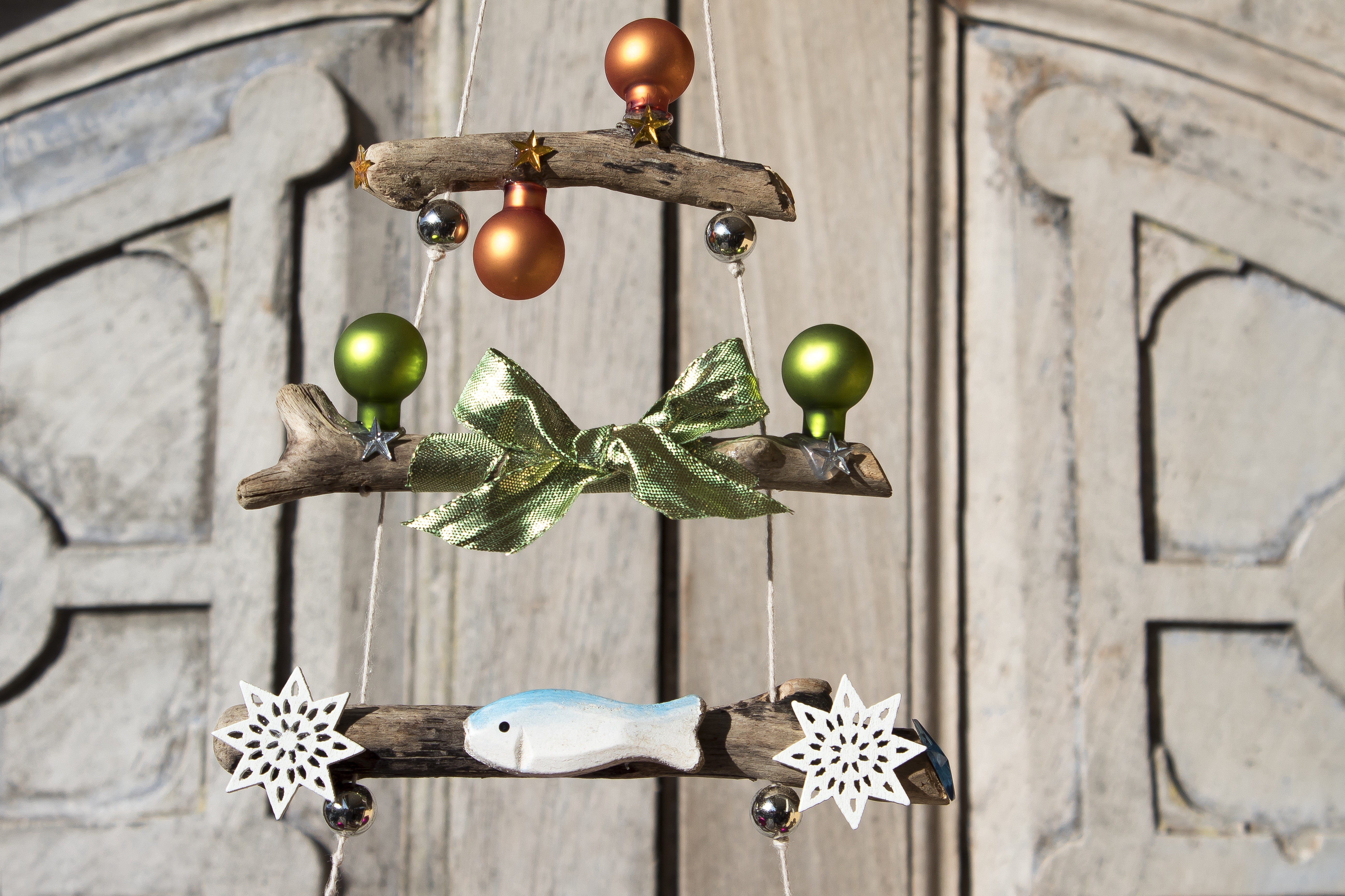 Christmas driftwood mobile with ornaments and fish HD Wallpaper