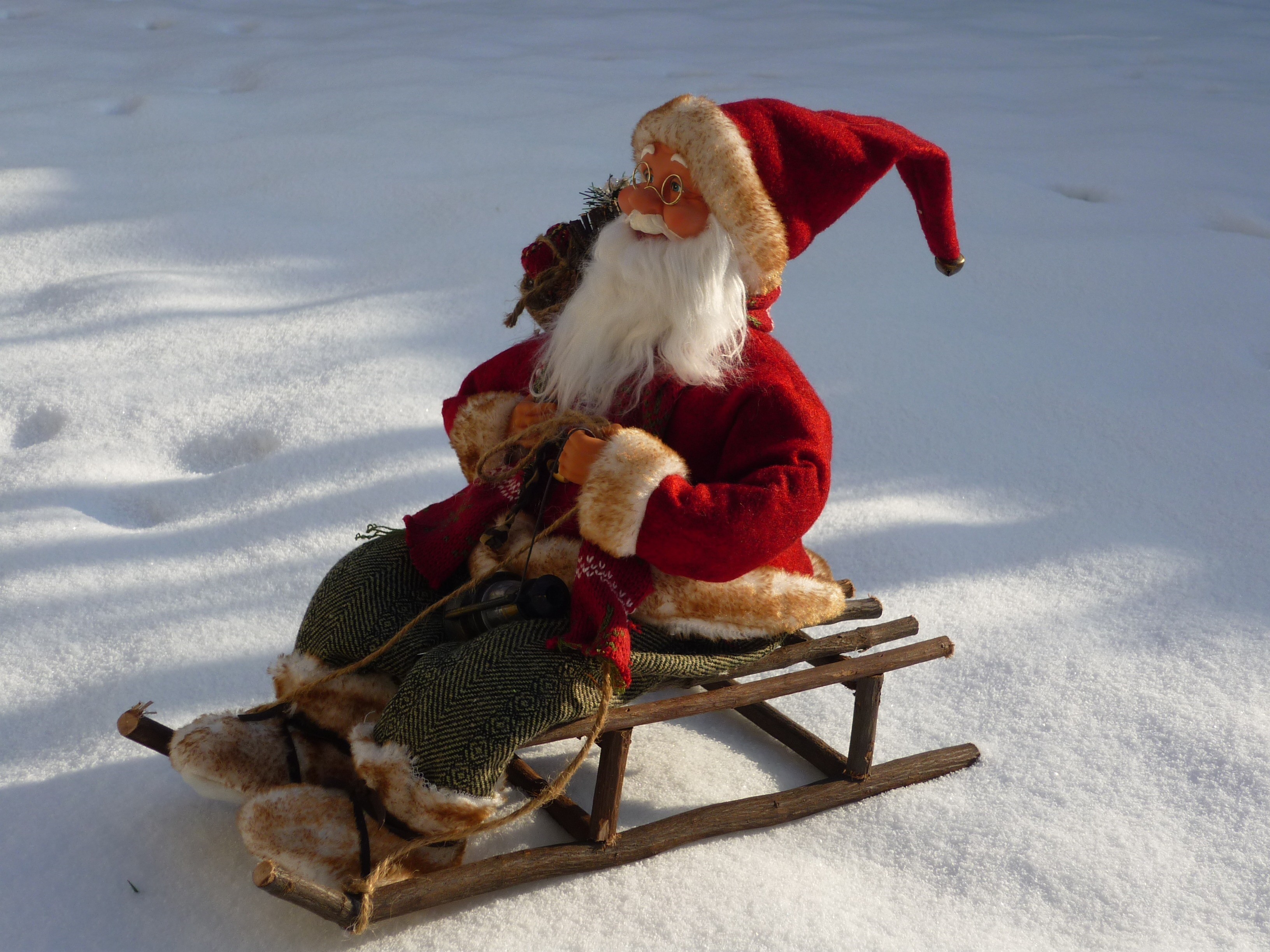 Santa Claus on a sled in the snow HD Wallpaper