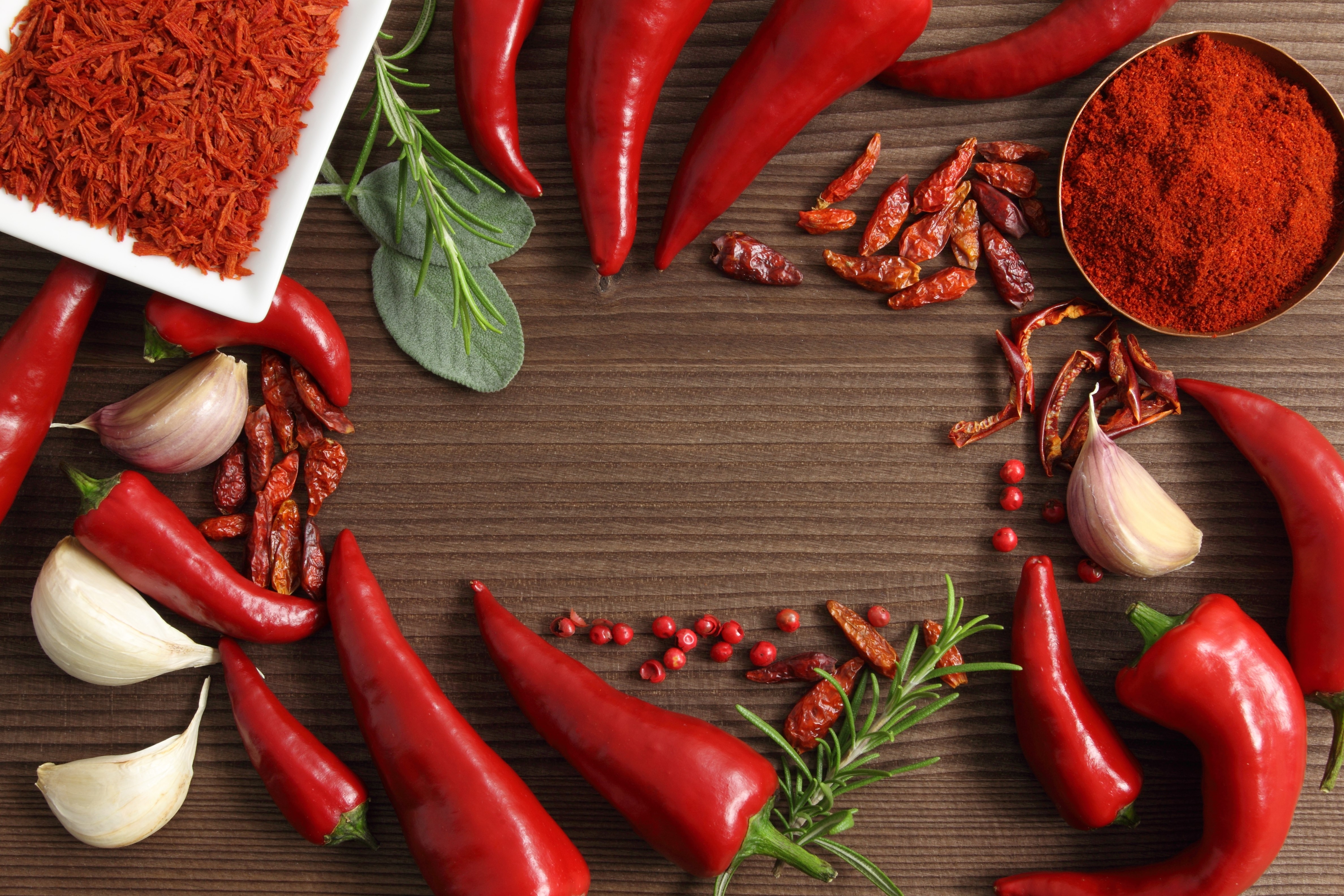 Chili Peppers, Garlic, and Spices on Wooden Table HD Wallpaper