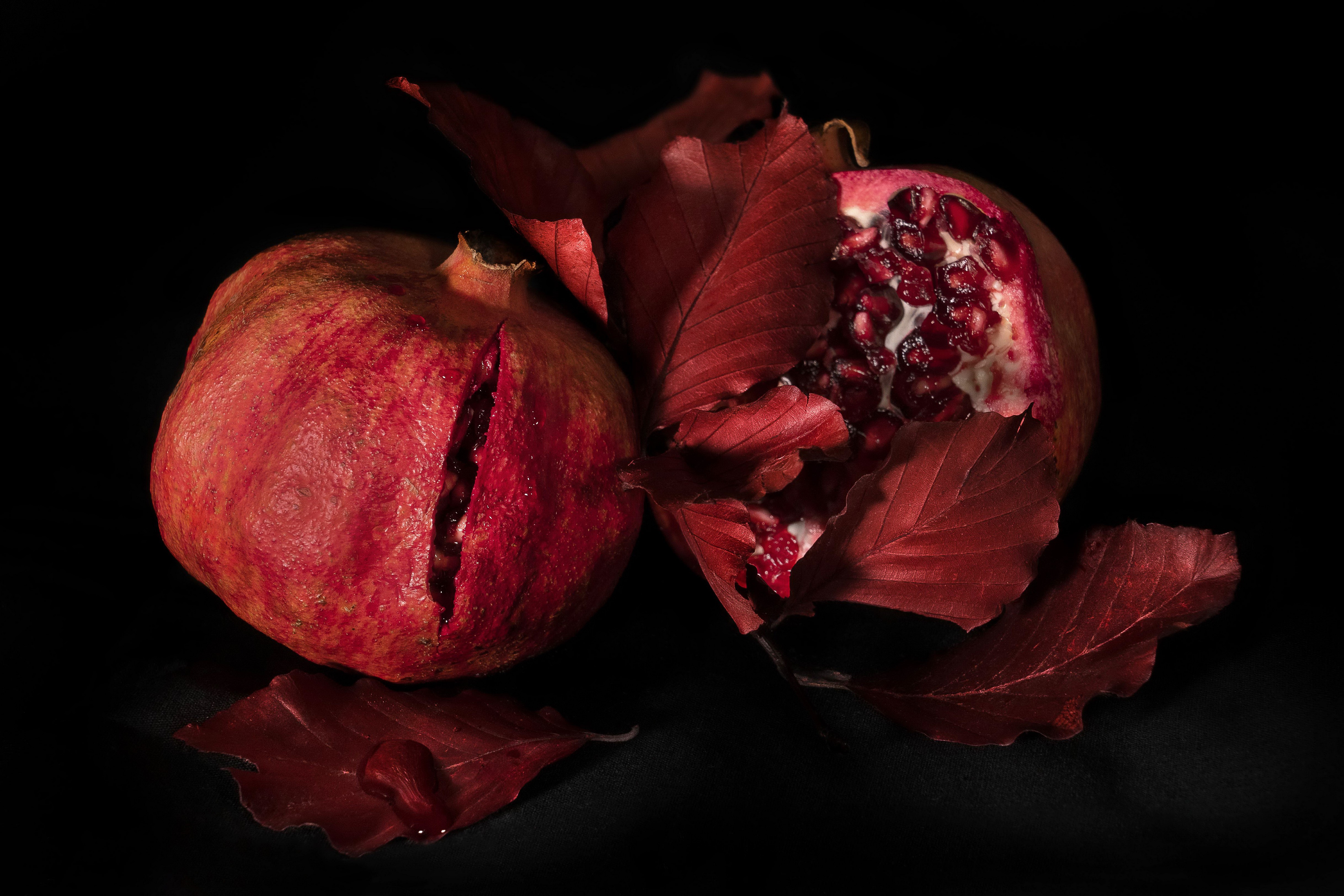 4K Pomegranate with Foliage on Black Background HD Wallpaper