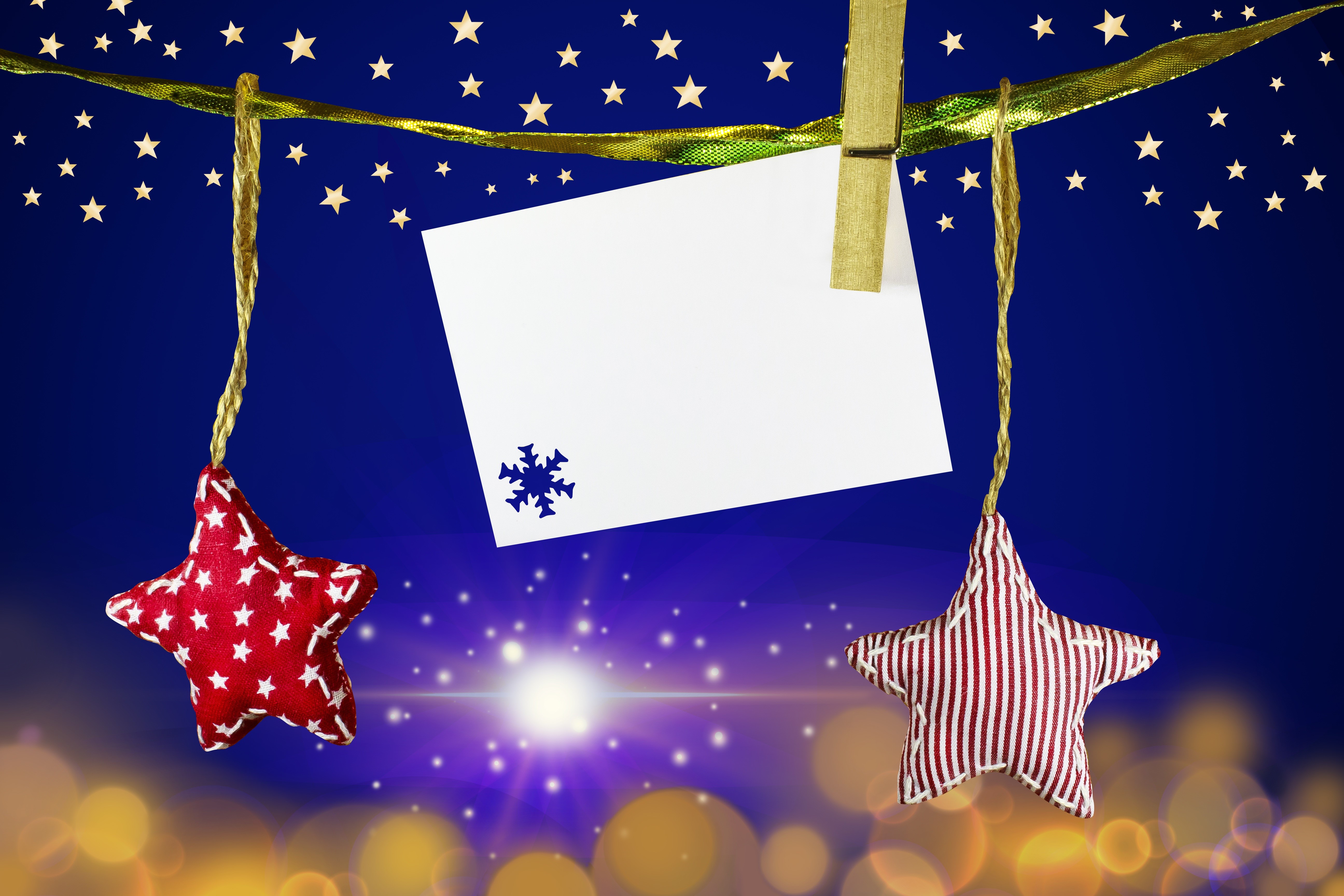 Christmas stars and blank card hanging on a ribbon HD Wallpaper