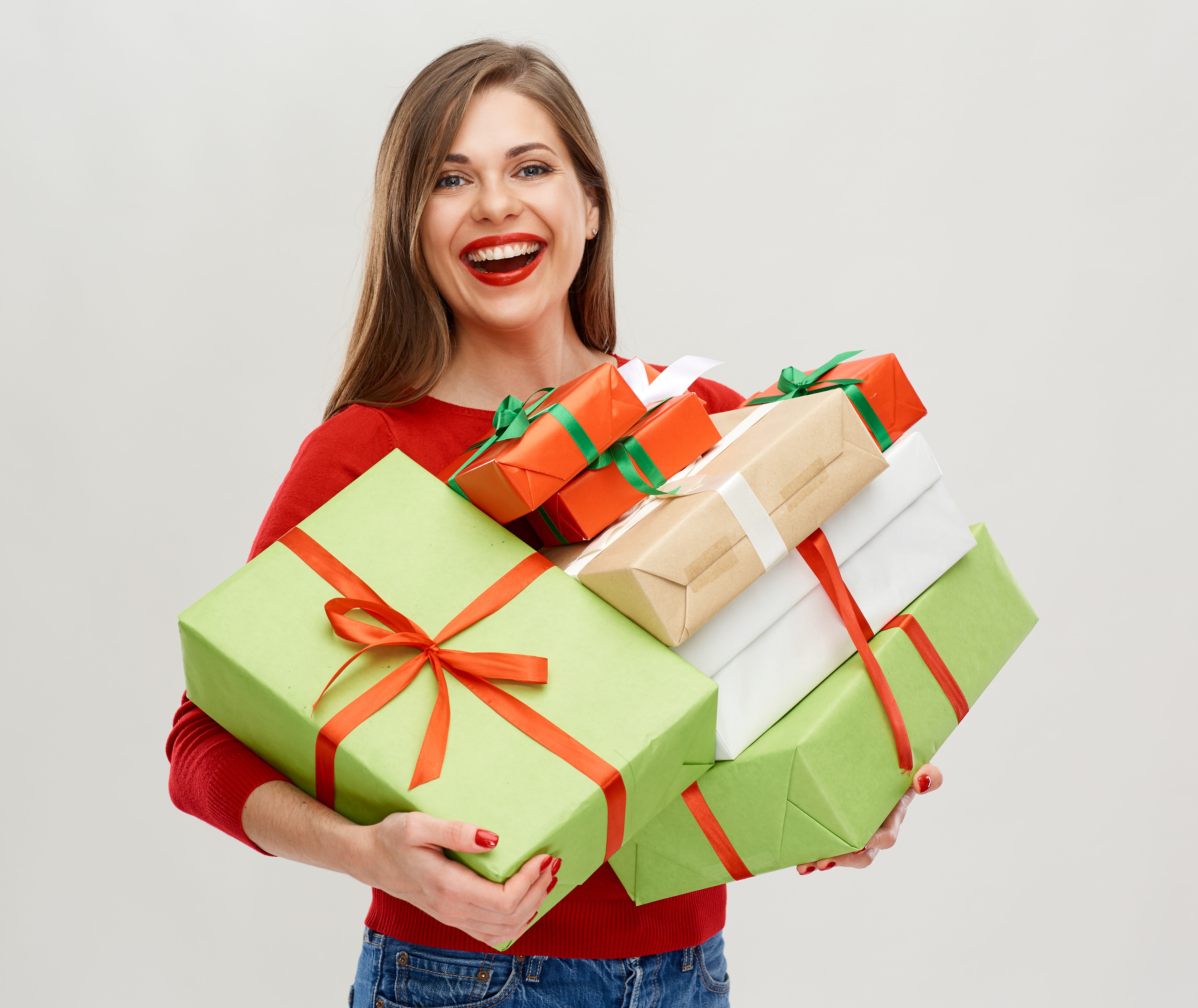 Woman holding many Christmas gifts HD Wallpaper