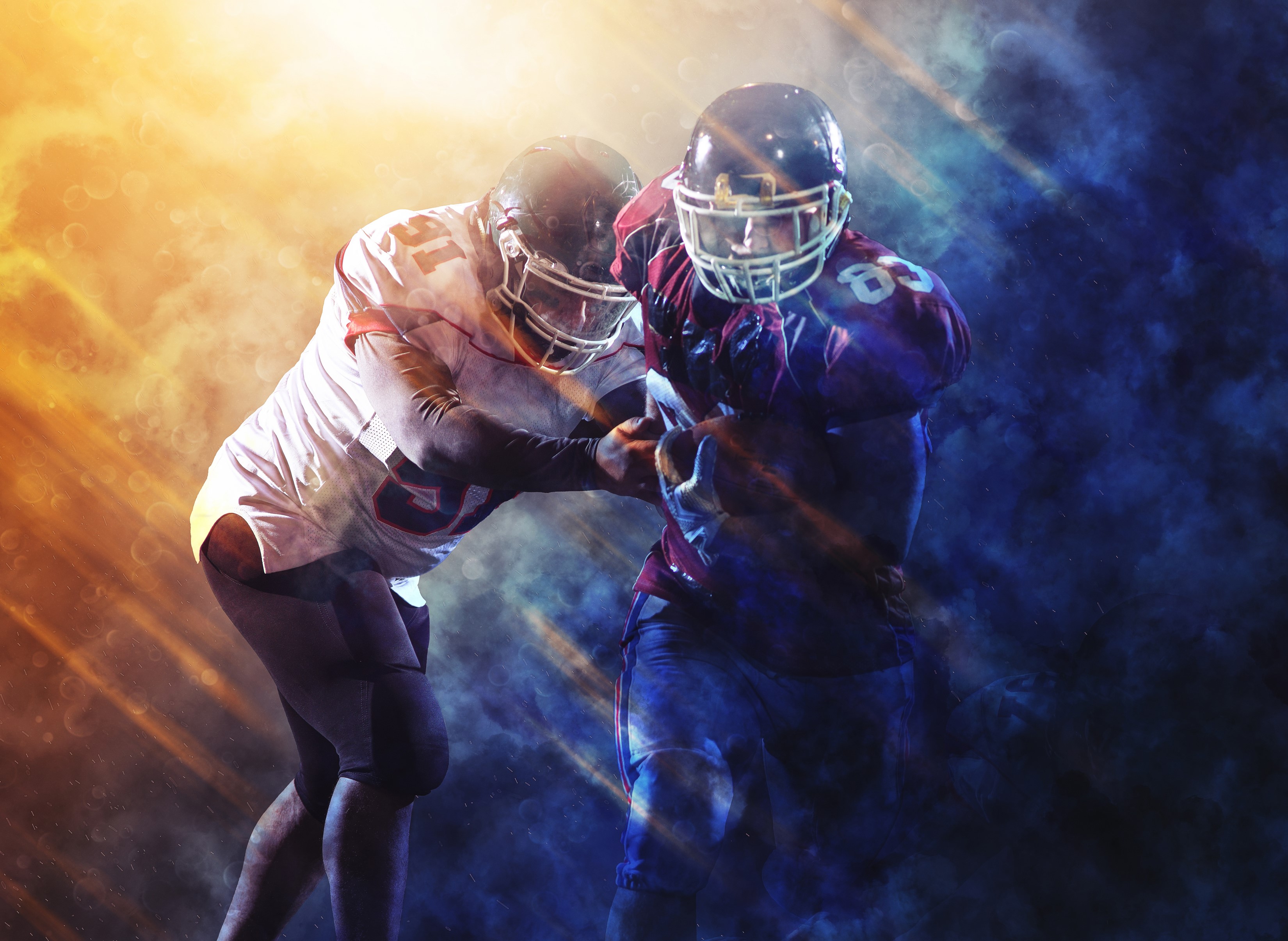 Two American football players in uniform and helmets HD Wallpaper
