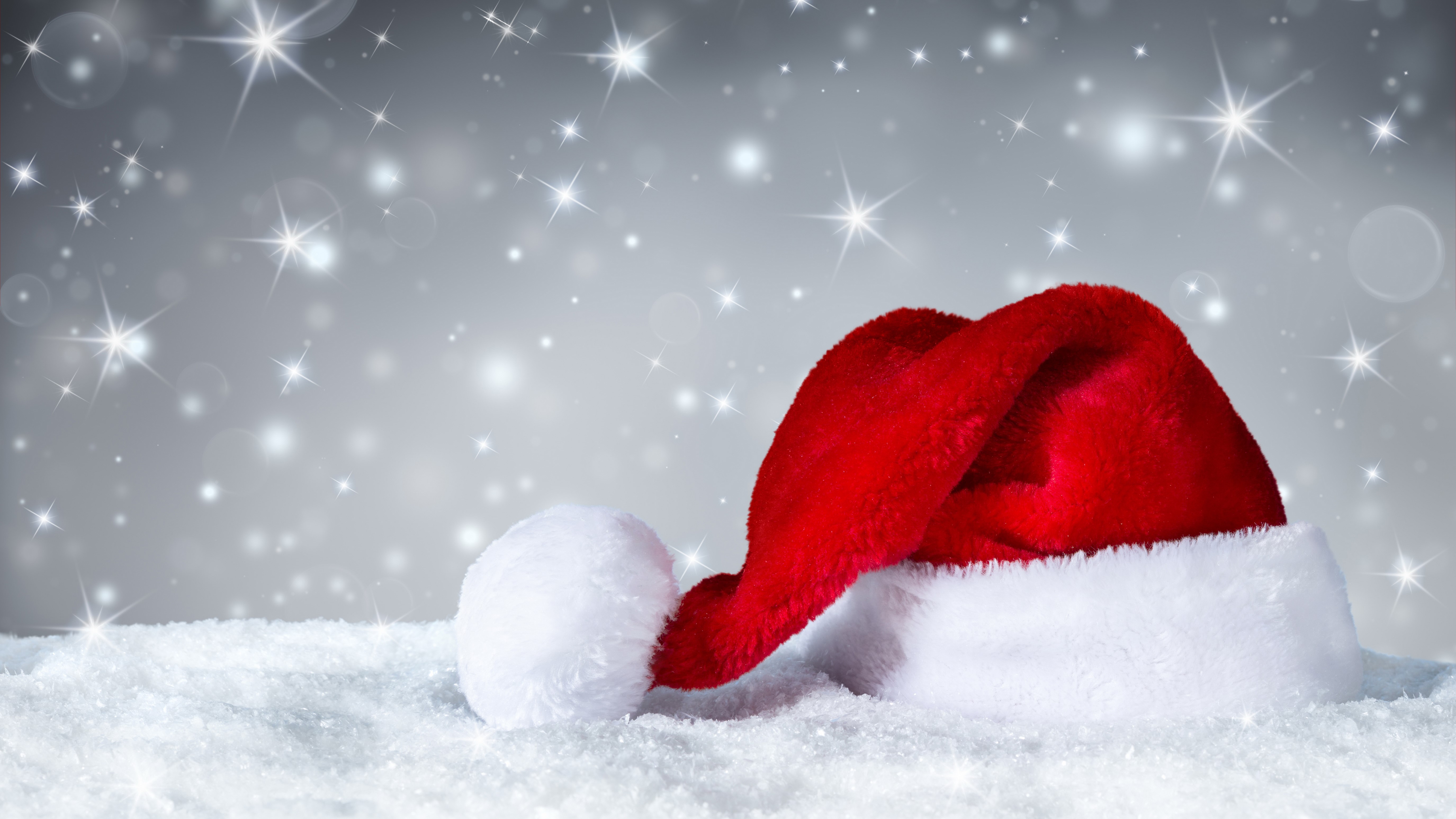 Christmas Santa Hat in Snow with Snowflakes HD Wallpaper