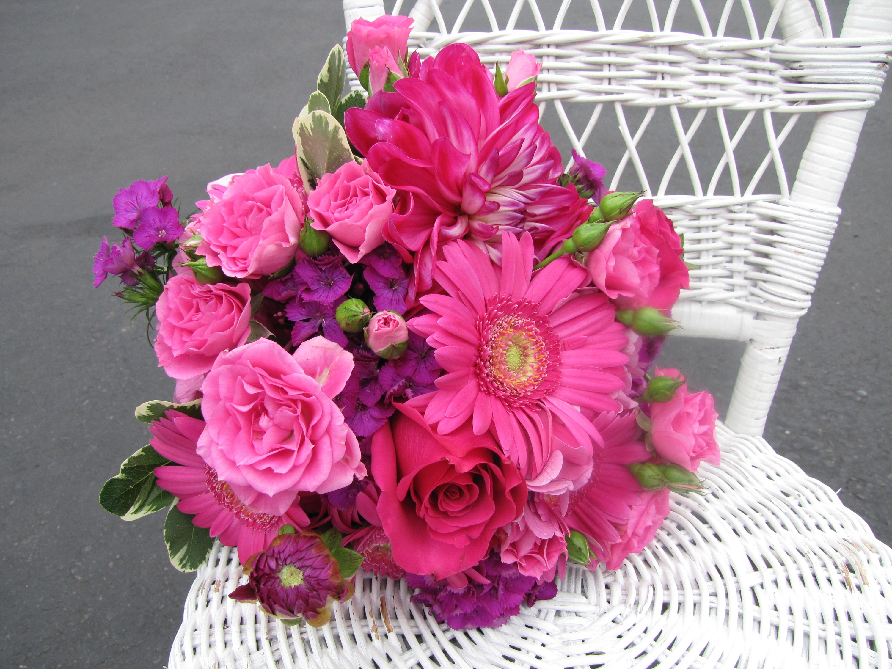 Pink and purple flower bouquet on a white wicker chair HD Wallpaper