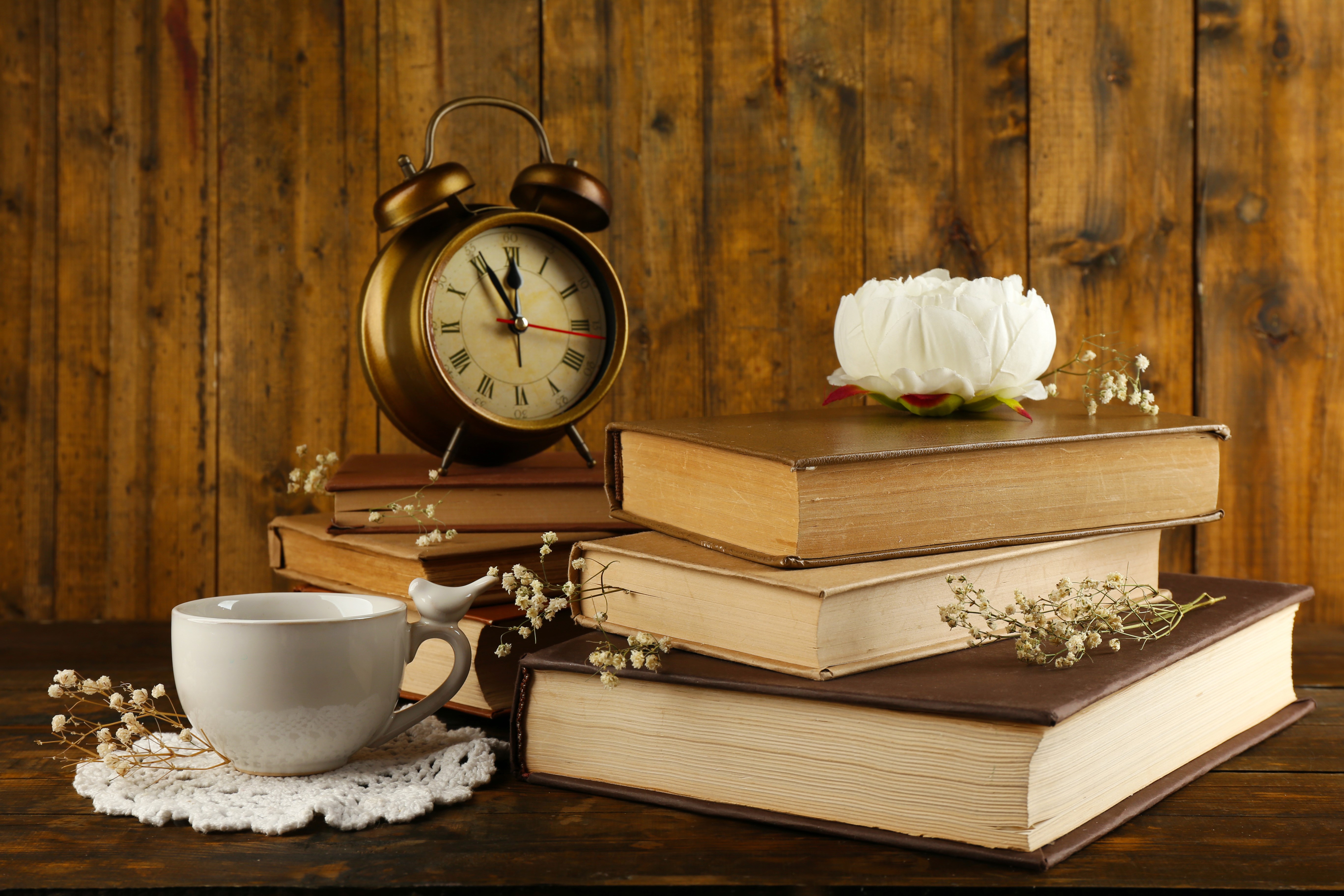 Still-life with alarm clock, books, and cup HD Wallpaper