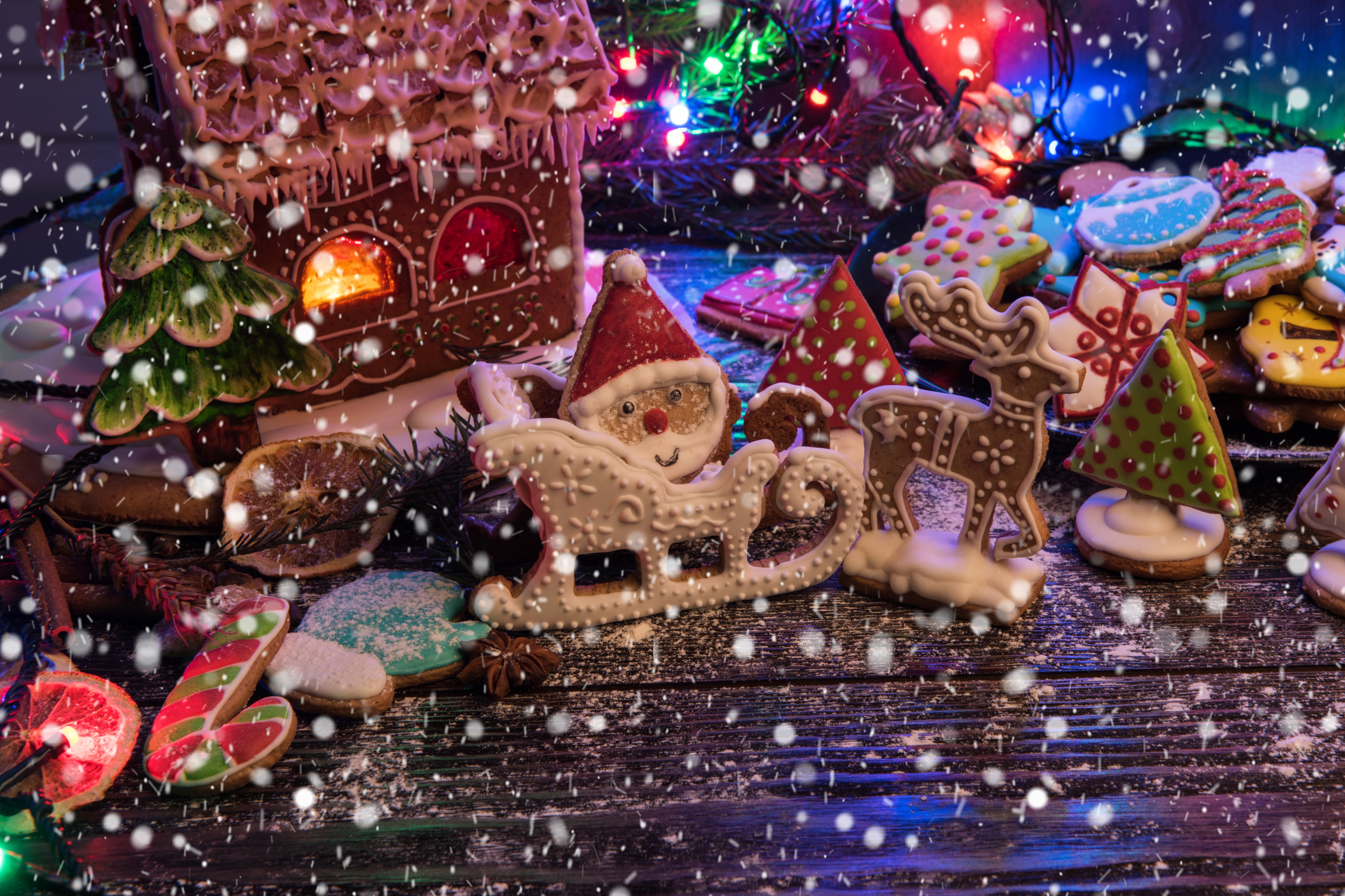 Christmas gingerbread house with cookies and lights HD Wallpaper