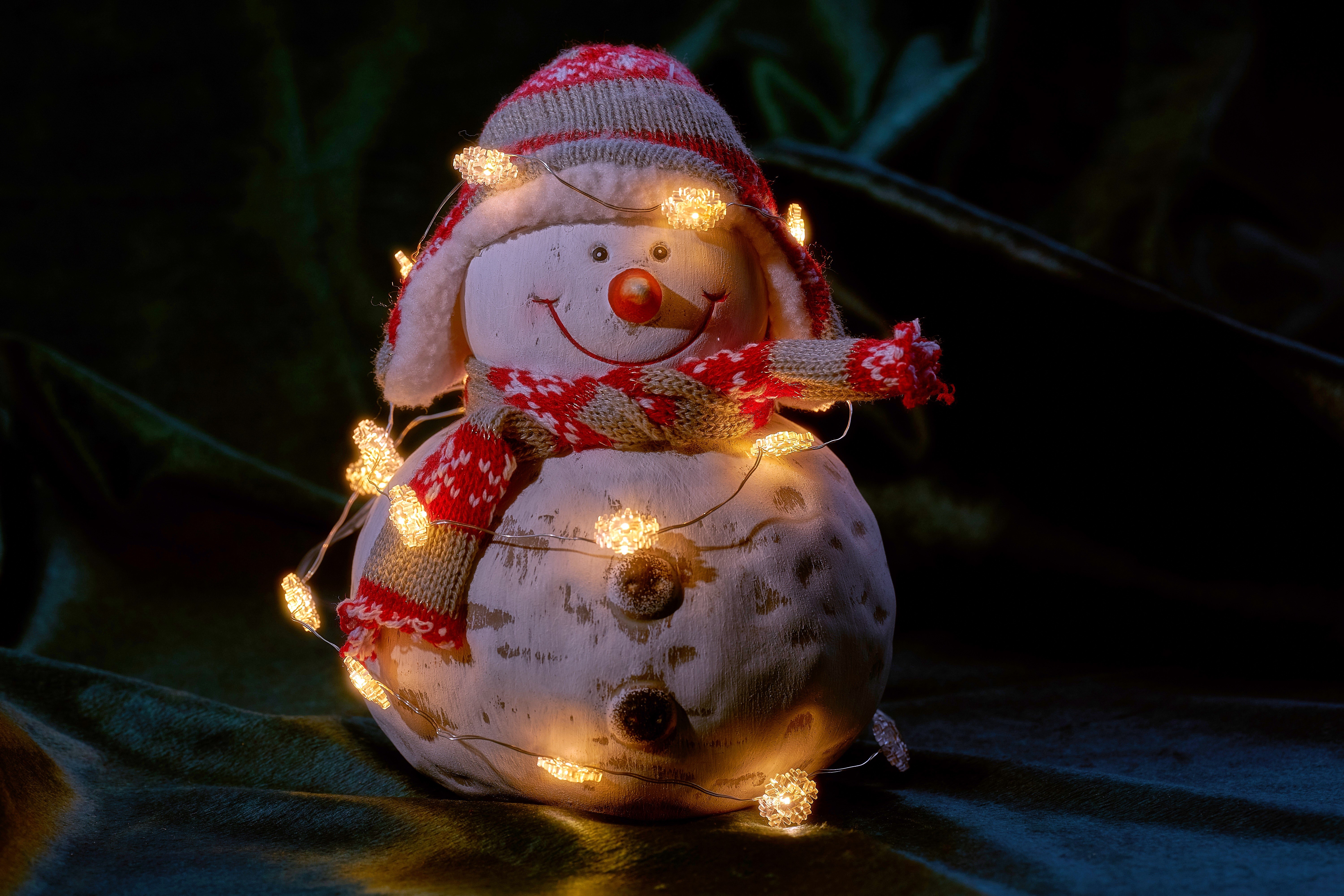Snowman with Christmas lights, hat, and scarf HD Wallpaper