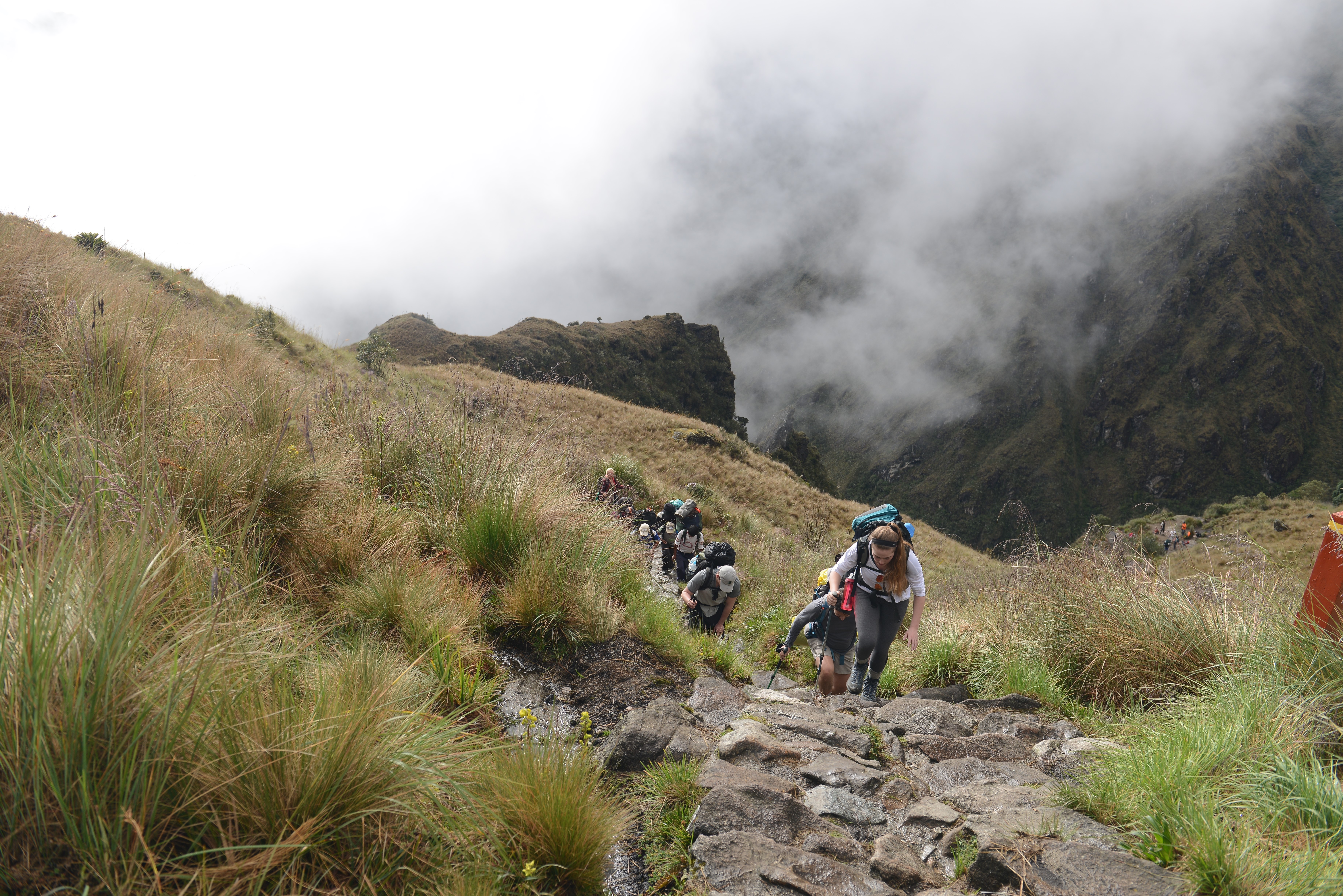Hikers on a stone trail in the mountains of Peru HD Wallpaper