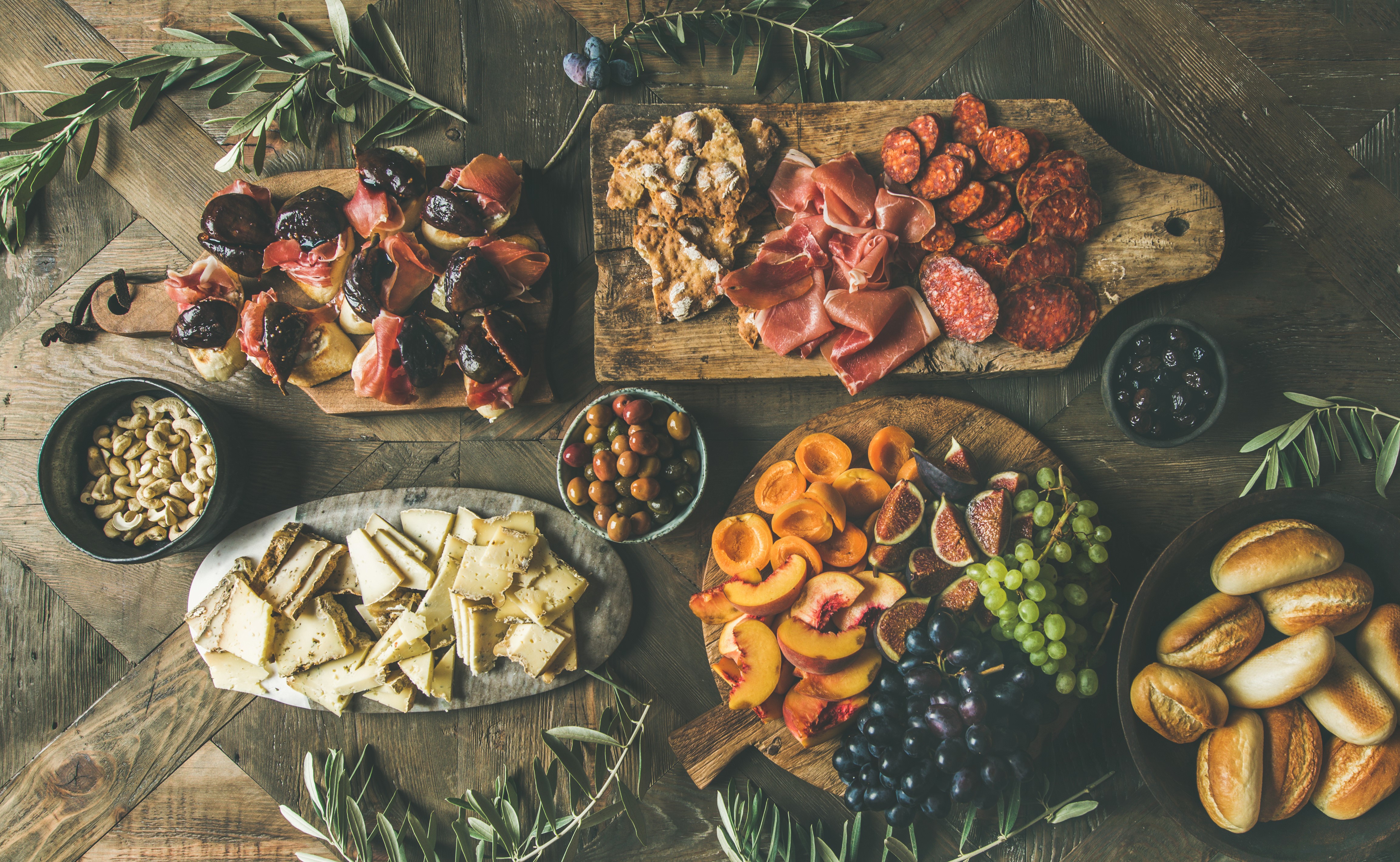 Charcuterie board with meats, cheeses, fruits, and nuts HD Wallpaper