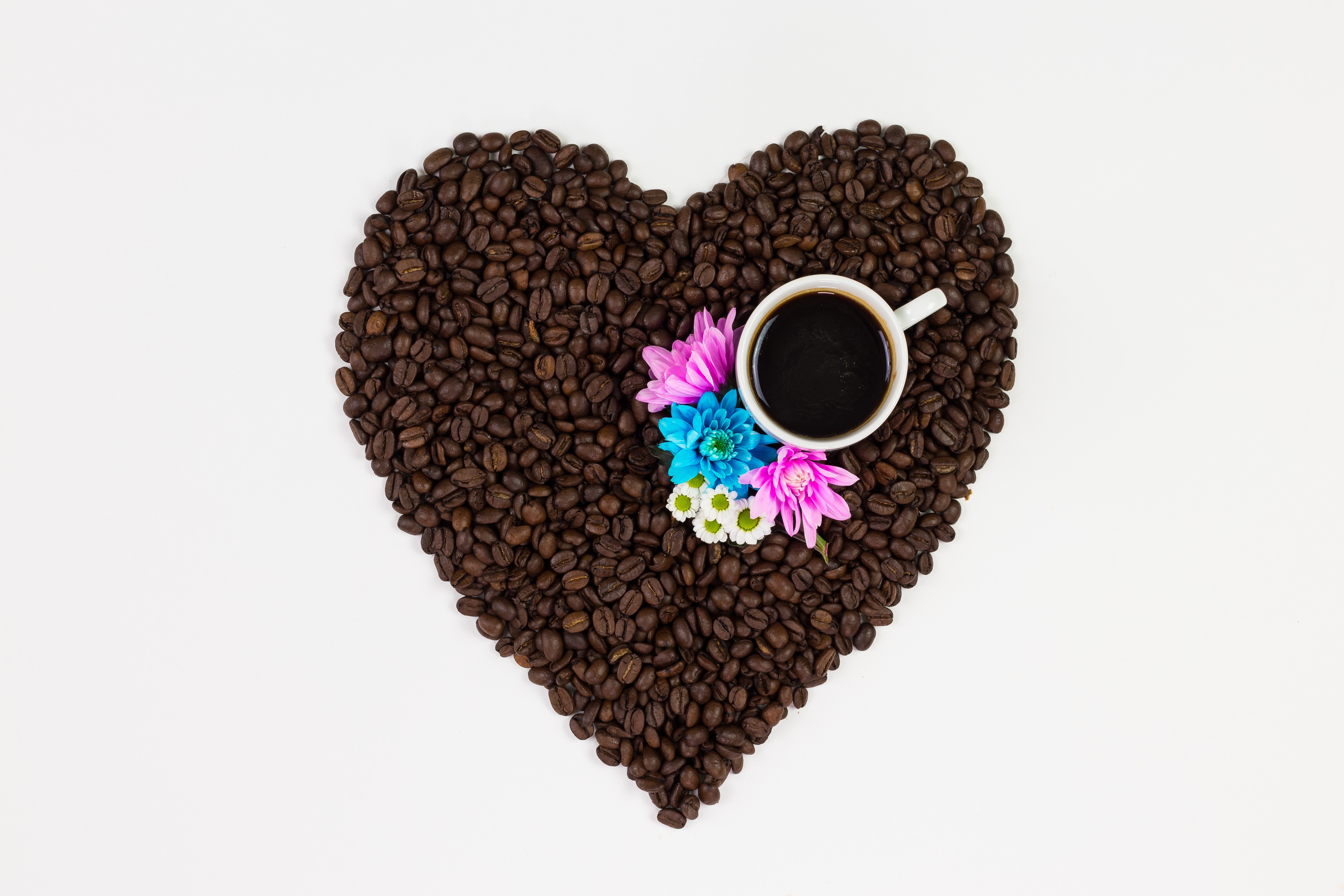 Heart shape made of coffee beans with a cup and flowers HD Wallpaper