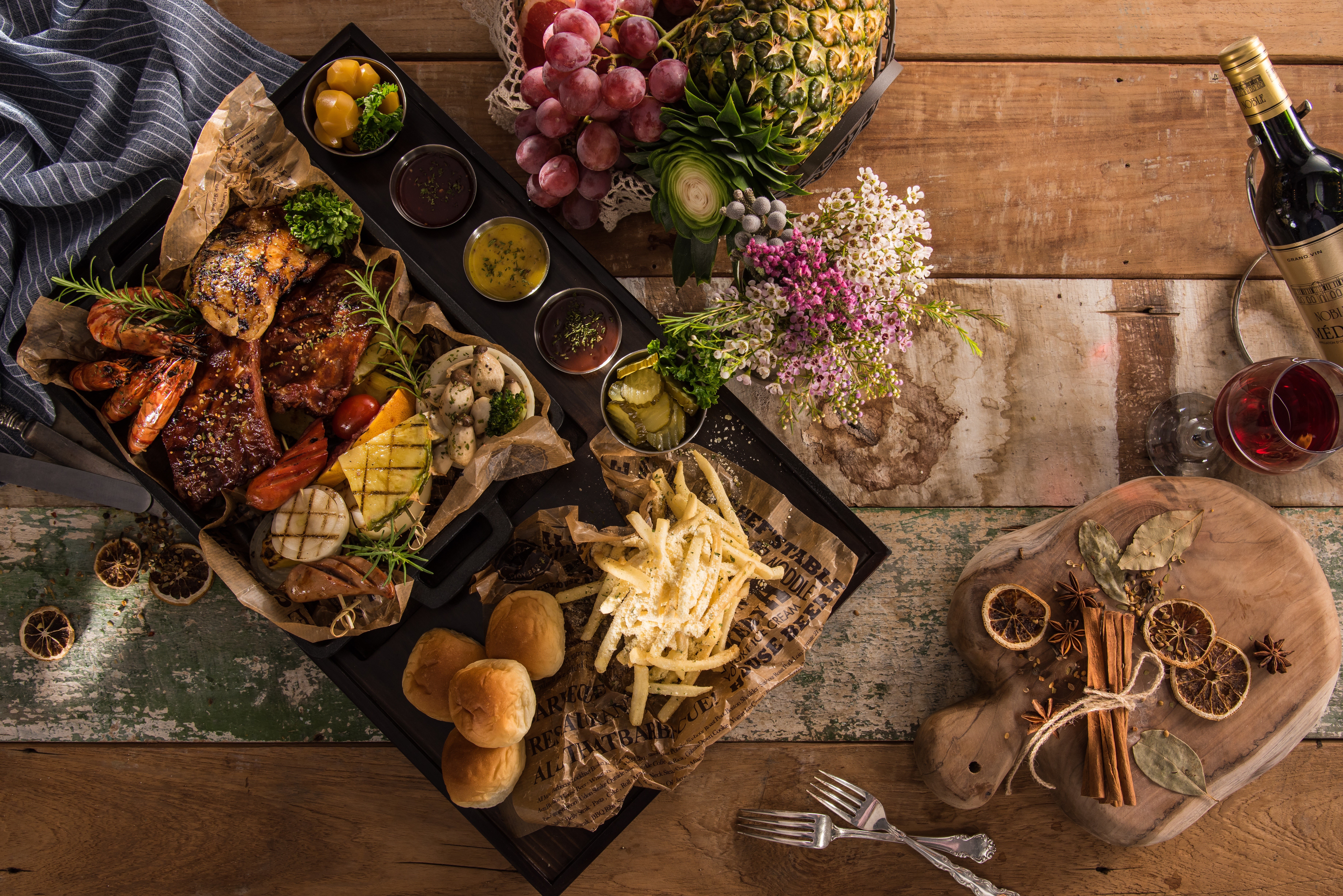 Meat platter with grapes, pineapple, and wine HD Wallpaper