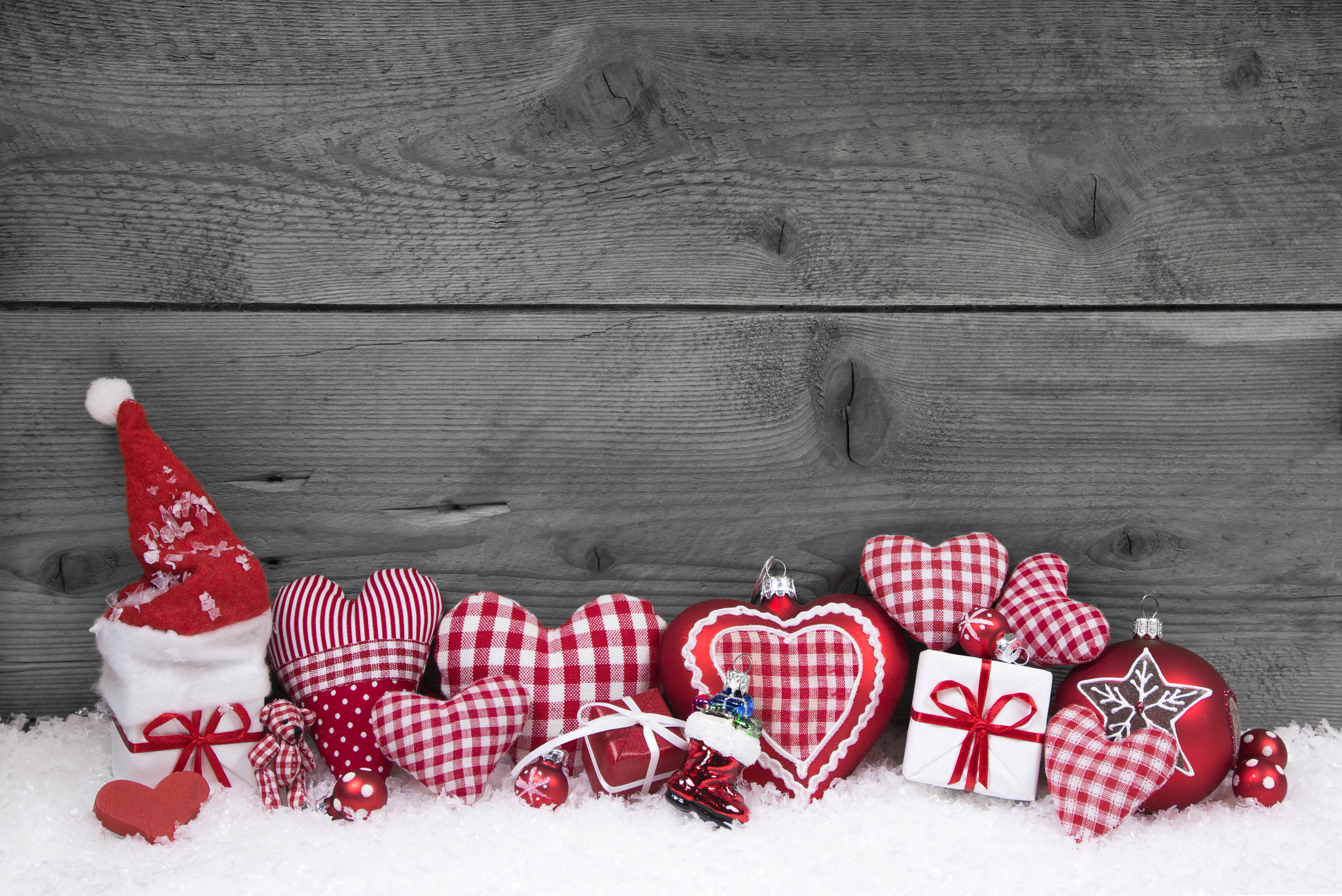 Christmas decorations on snow with wooden background HD Wallpaper