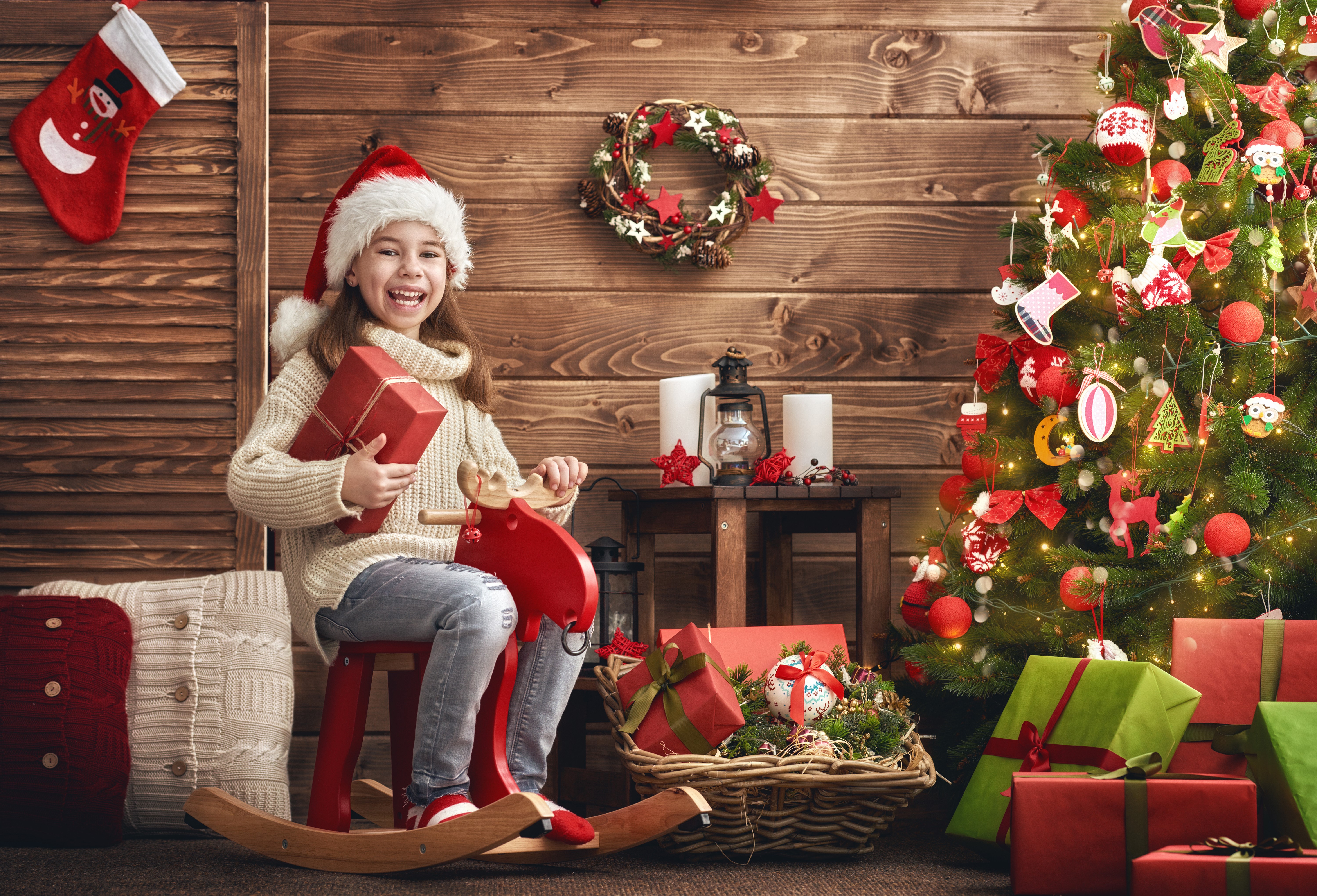 Girl in Santa hat with Christmas gifts HD Wallpaper