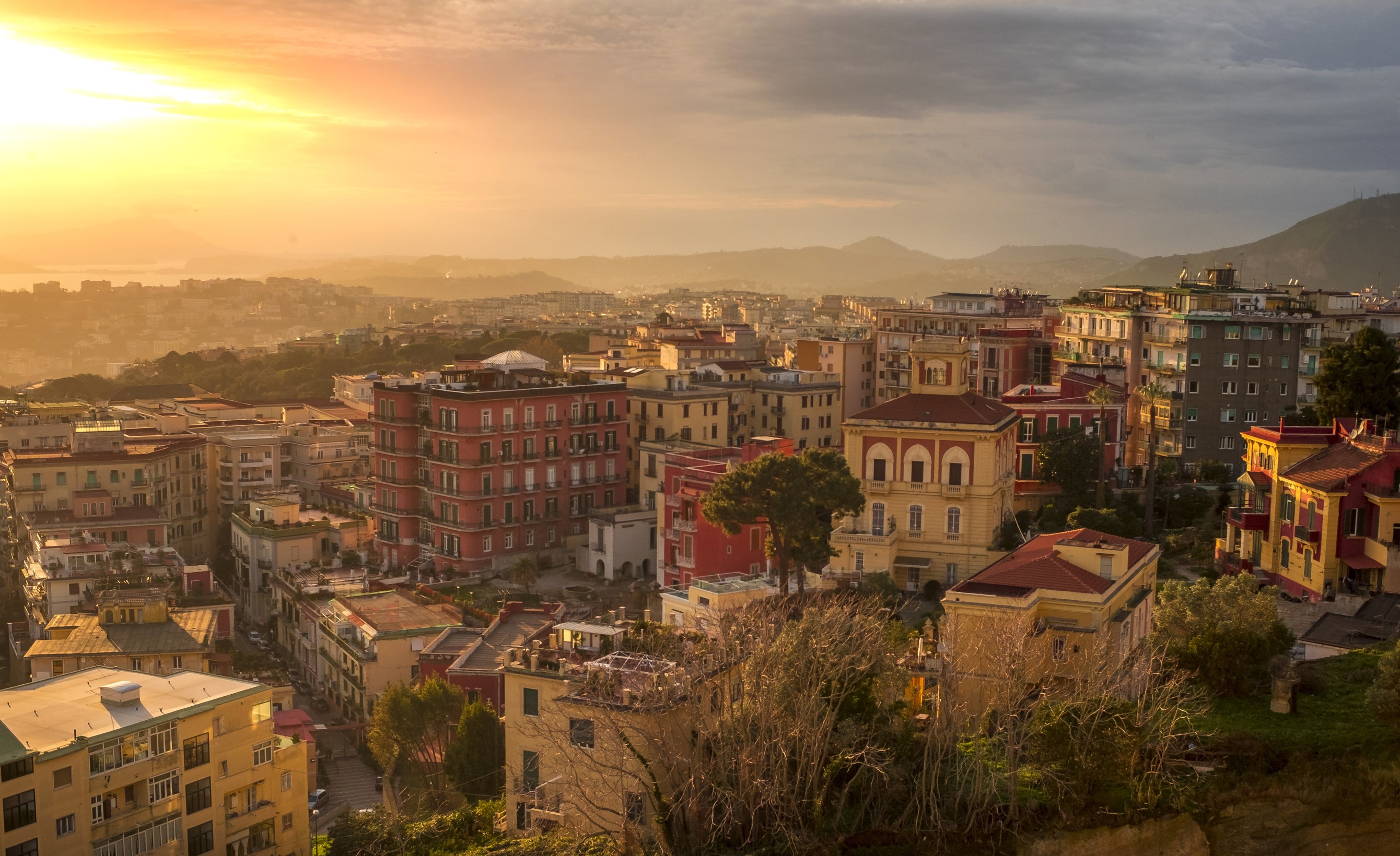 Naples cityscape at sunset with colorful buildings HD Wallpaper