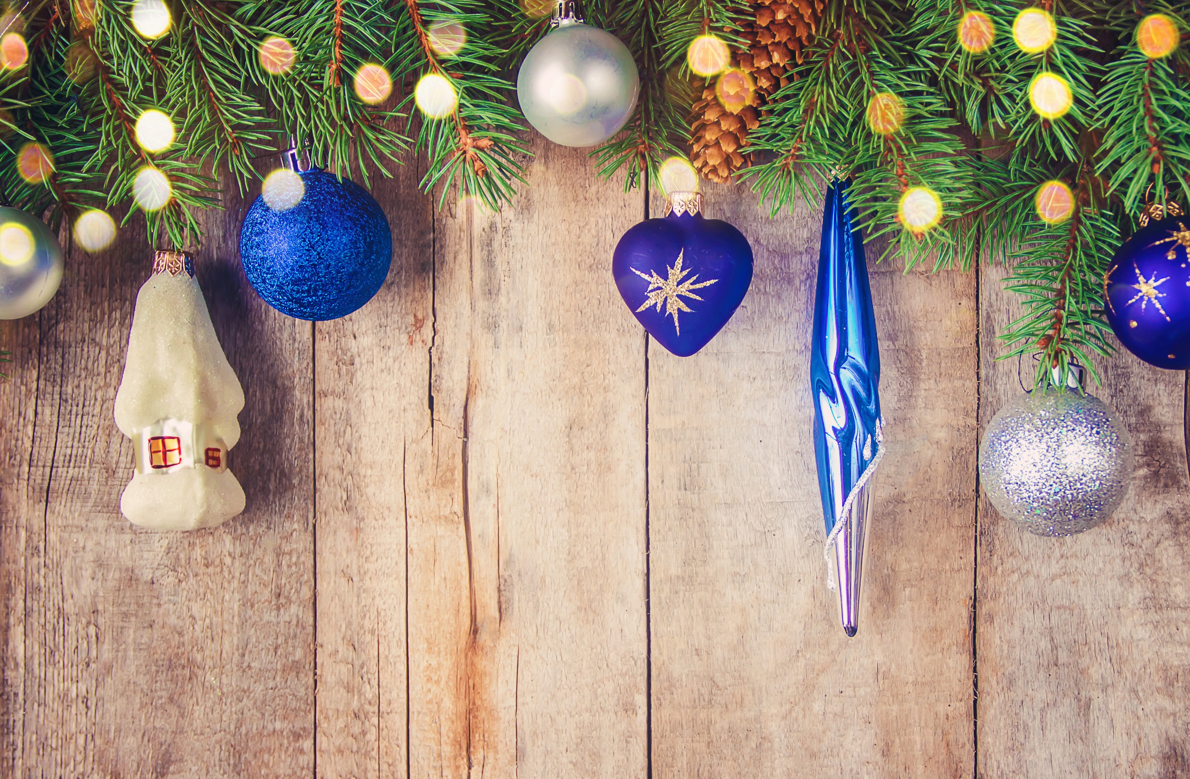 Christmas ornaments on wood planks with fairy lights HD Wallpaper