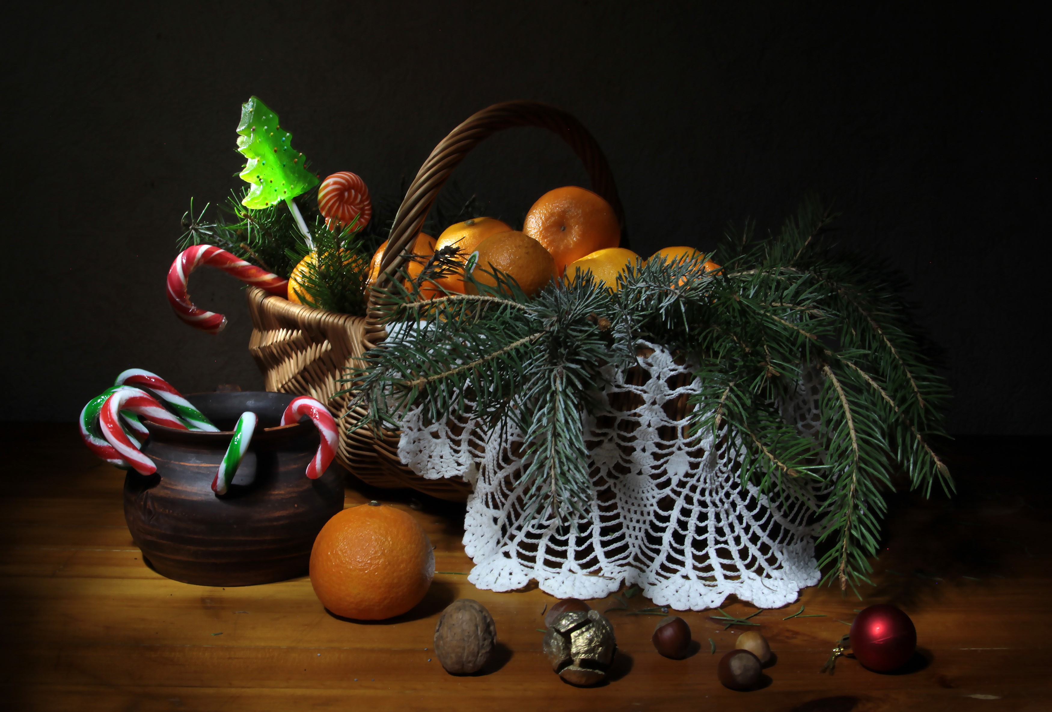 Christmas still life with tangerines, candy canes, and nuts HD Wallpaper