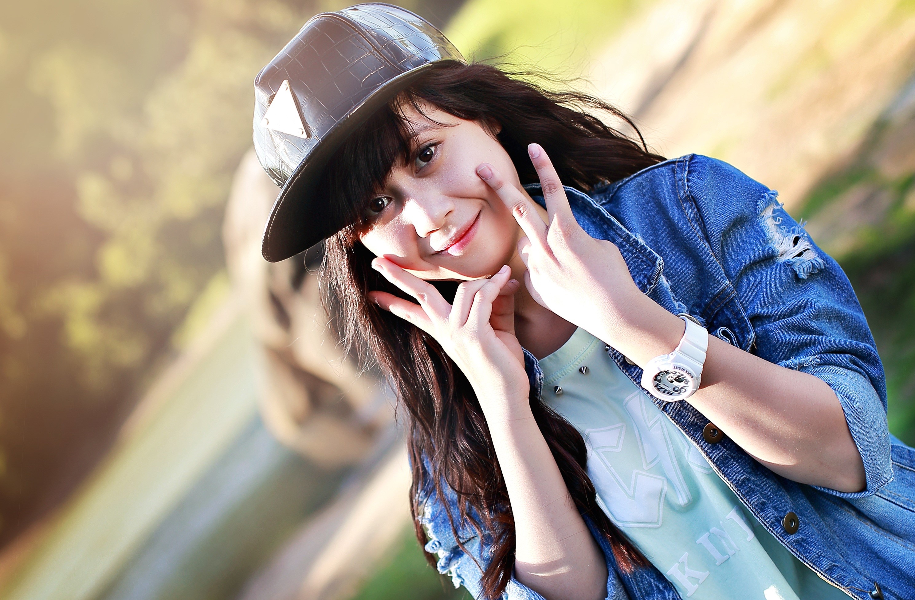 Brunette girl in baseball cap and denim jacket HD Wallpaper