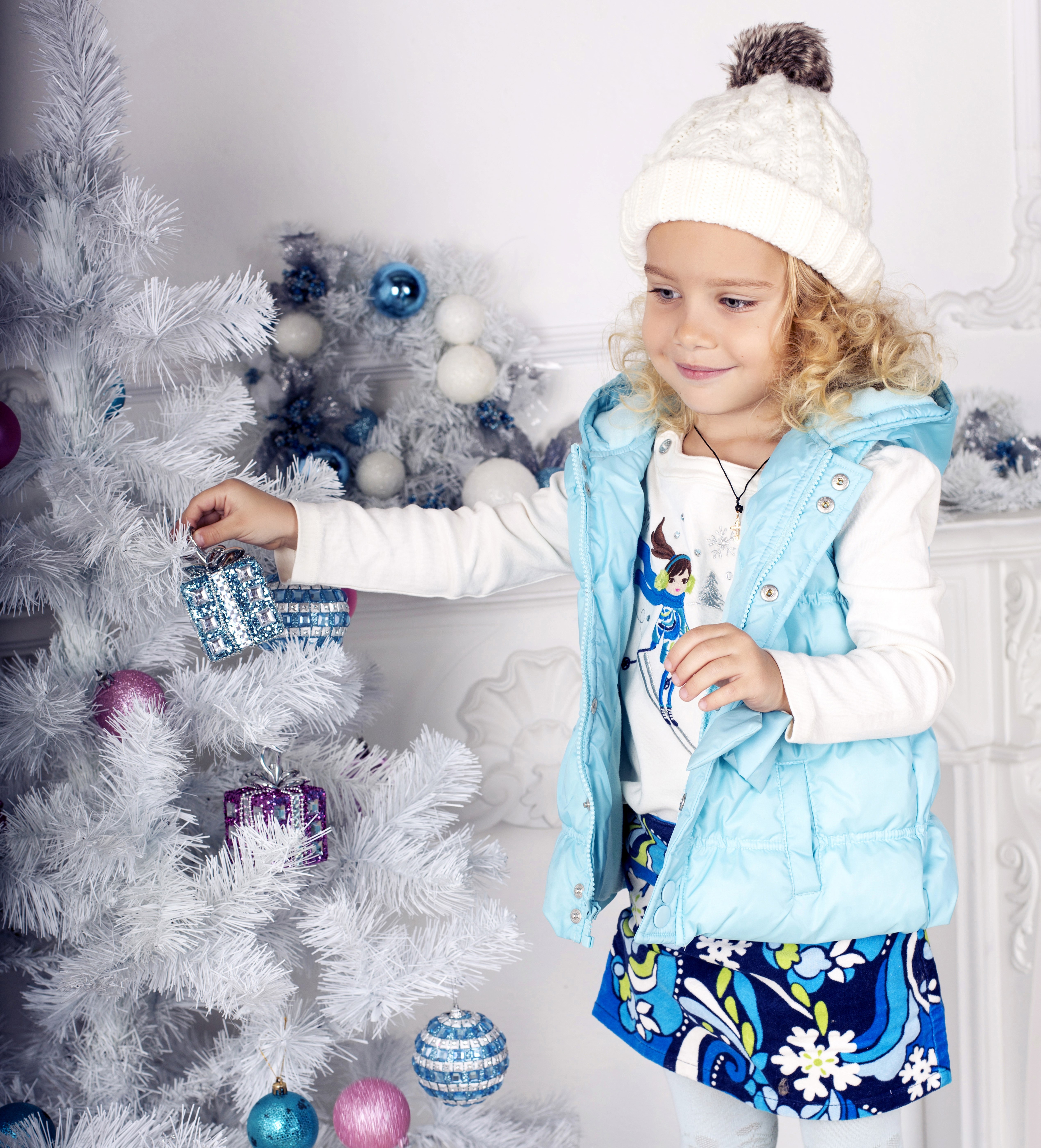 Little girl decorating a white Christmas tree HD Wallpaper