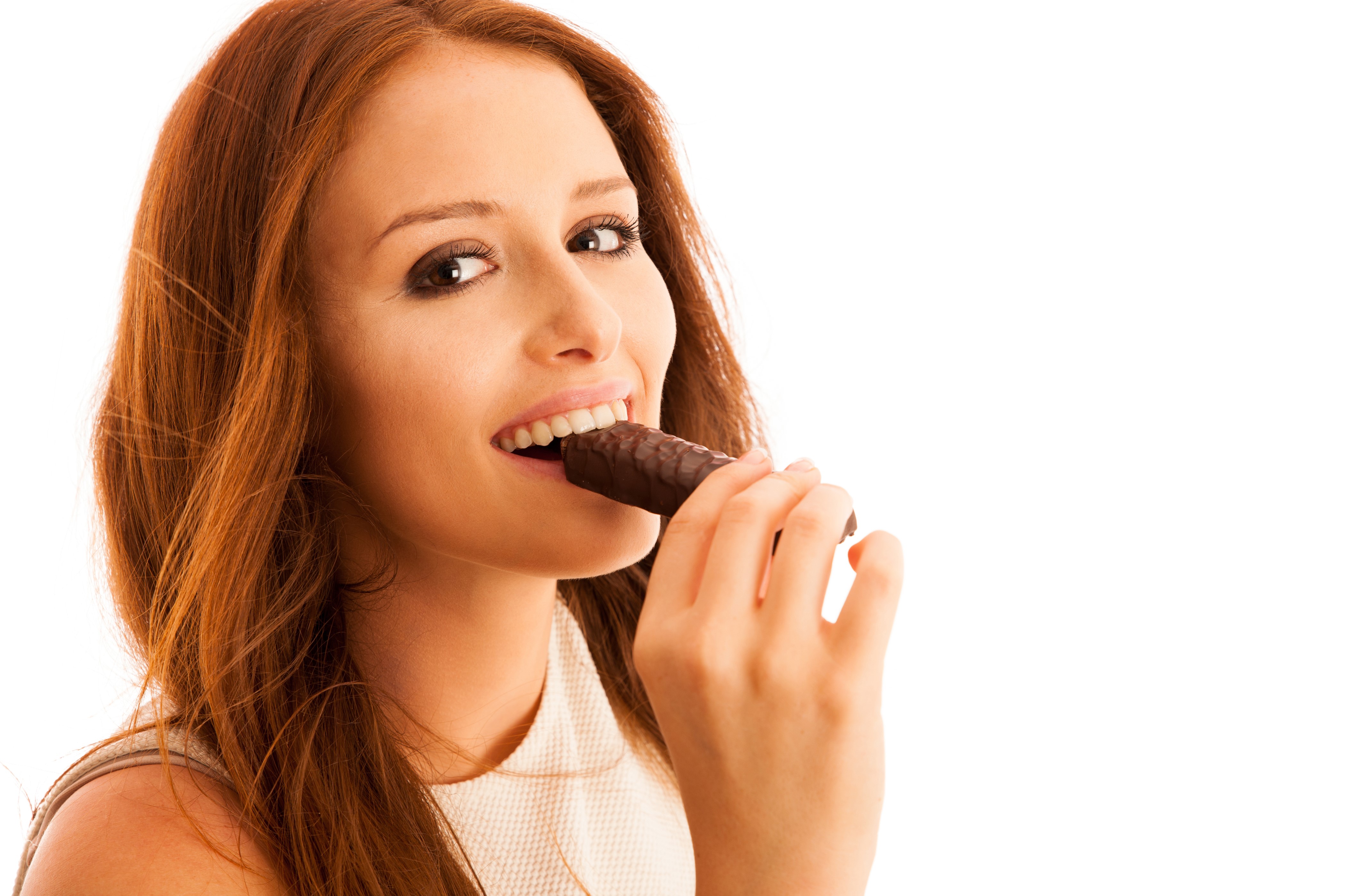 Redhead girl eating chocolate bar HD Wallpaper